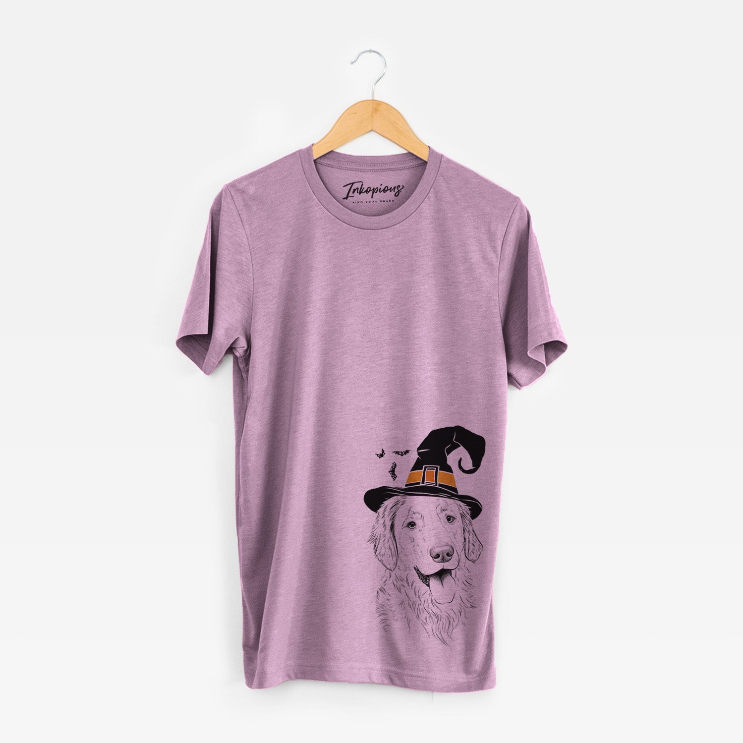 Hand-drawn sketch of Semba the Golden Retriever wearing a witch hat on an Orchid Unisex crewneck