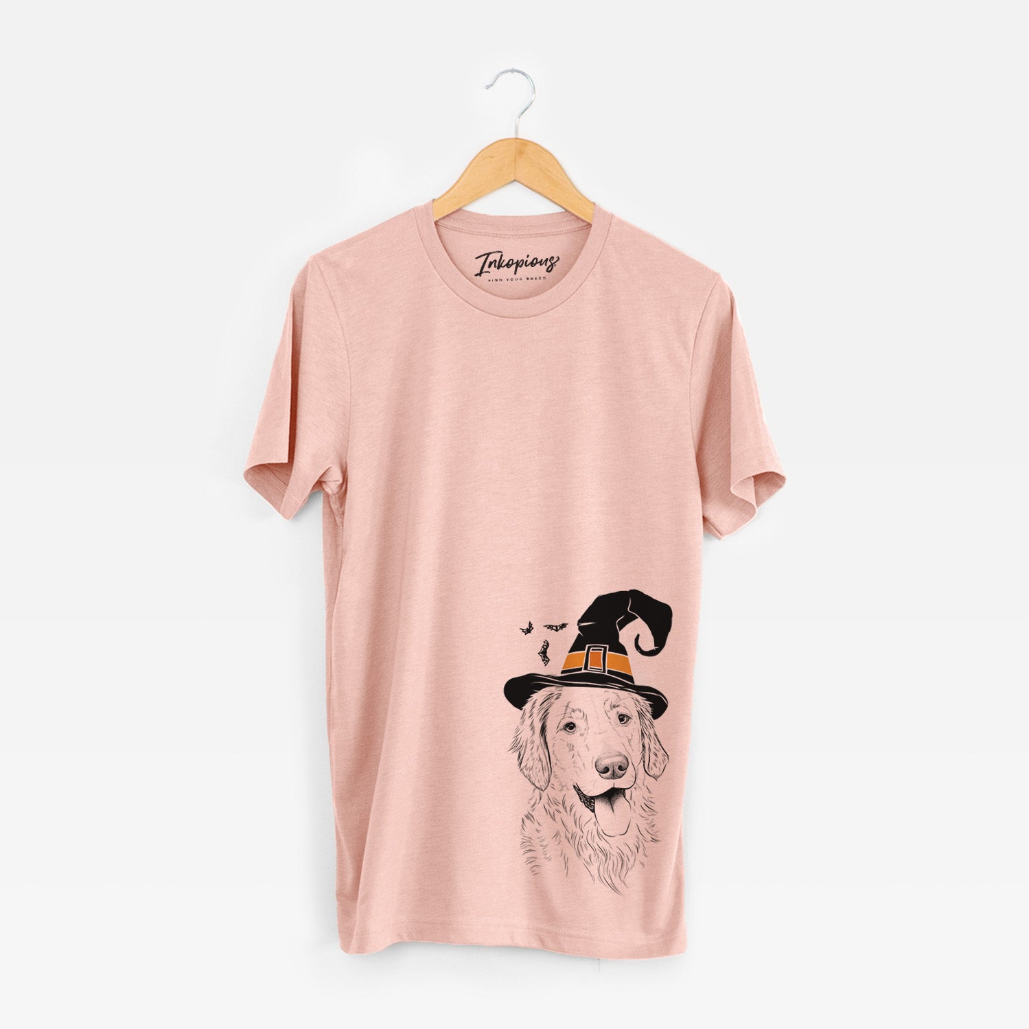 Hand-drawn sketch of Semba the Golden Retriever wearing a witch hat on a Peach Unisex crewneck