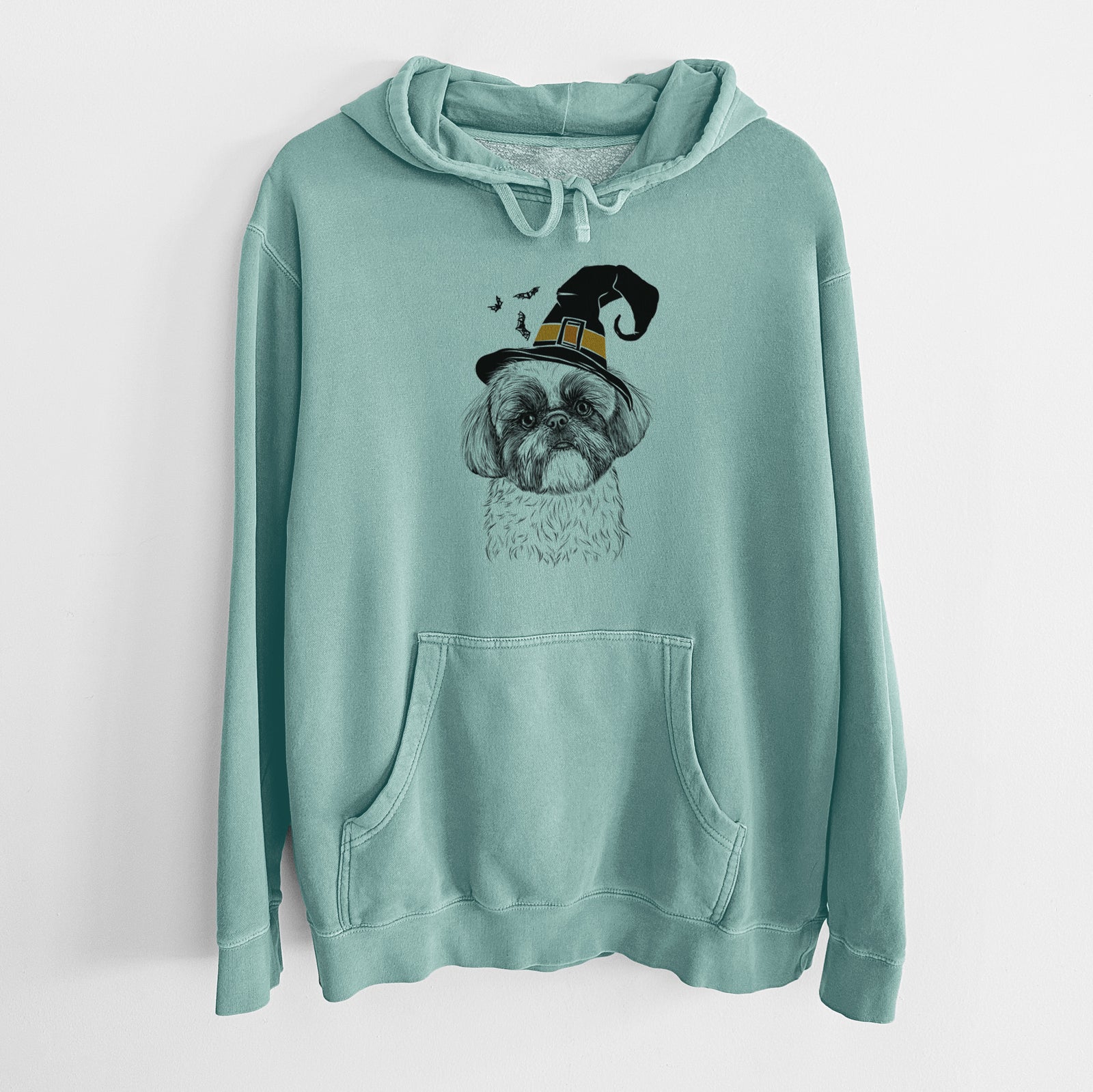 Hand-drawn sketch of Simon the Shih Tzu wearing a witch hat on a Mint Unisex pigment dyed hoodie