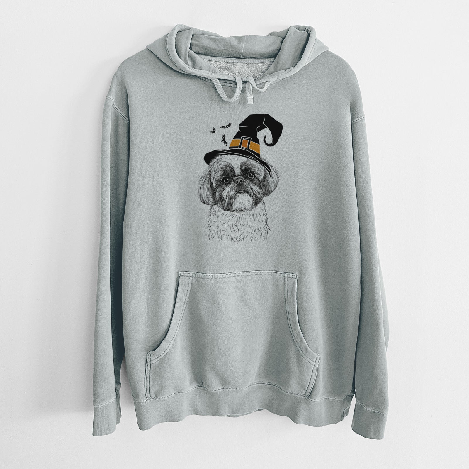 Hand-drawn sketch of Simon the Shih Tzu wearing a witch hat on a Sage Unisex pigment dyed hoodie