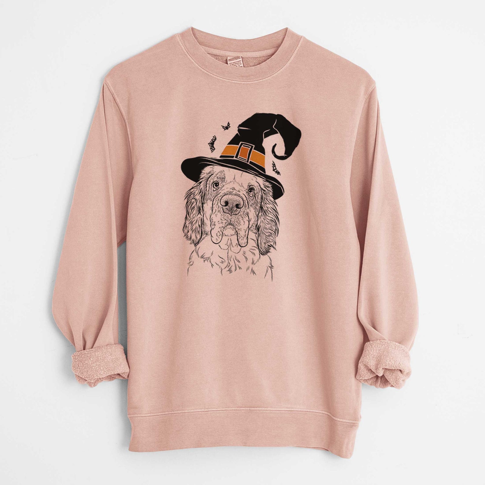 Hand-drawn sketch of Sully the Clumber Spaniel wearing a witch hat on a Dusty Pink Unisex pigment dyed crew sweatshirt
