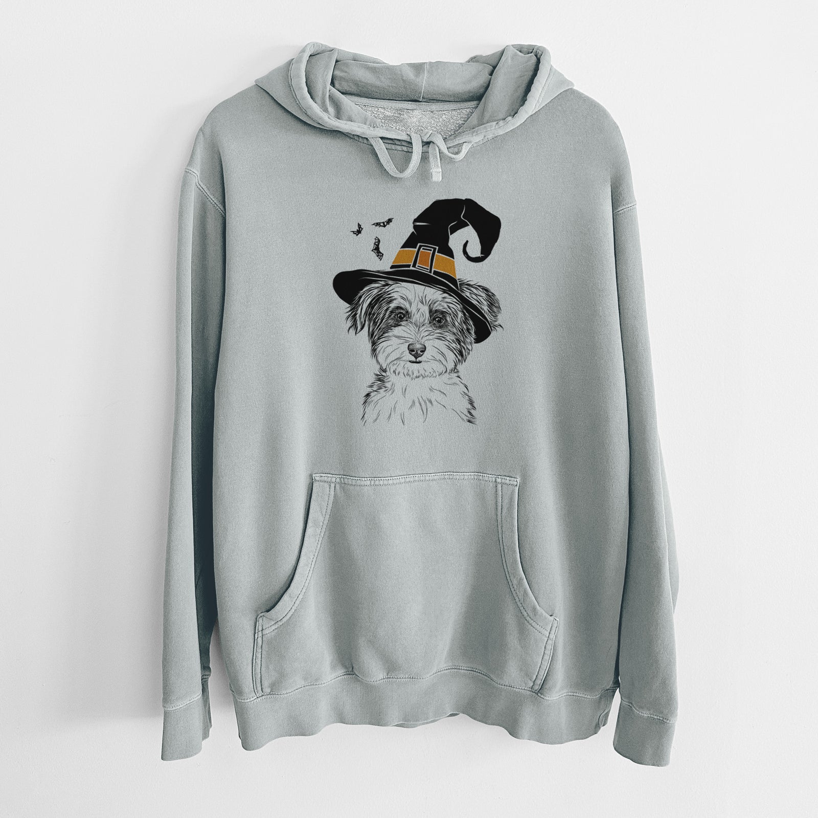 Hand-drawn sketch of Teddy the Havanese wearing a witch hat on a Sage Unisex pigment dyed hoodie