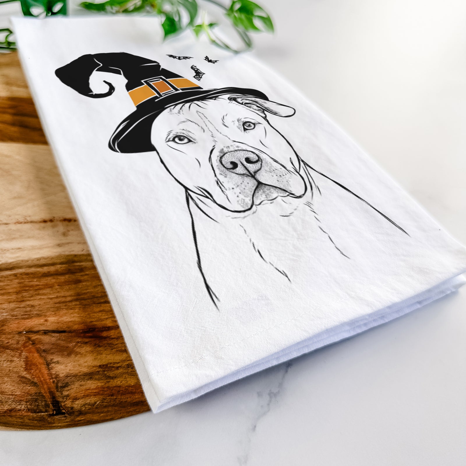 Hand-drawn sketch of Teddy Jam the Pitbull wearing a witch hat on a tea towel