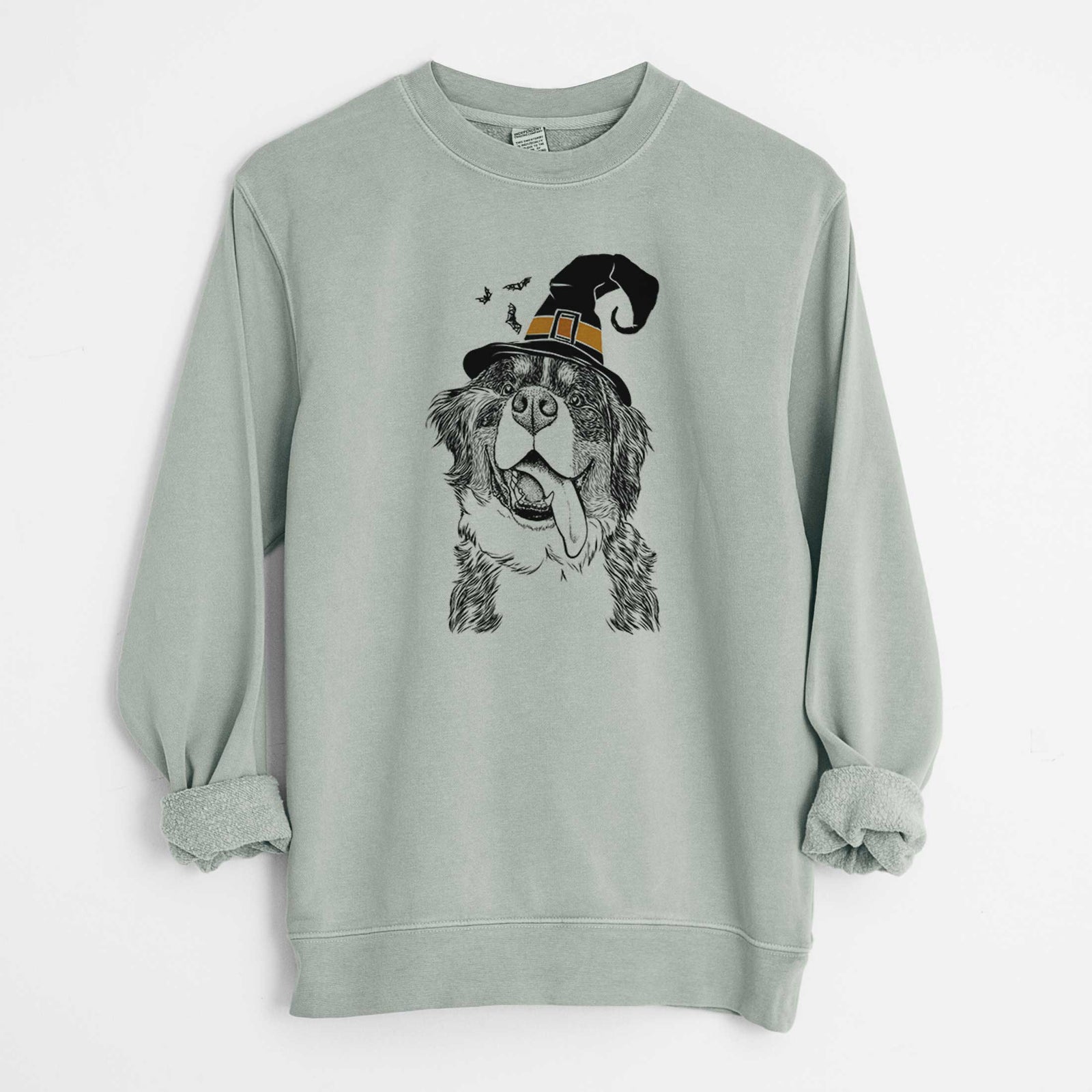Hand-drawn sketch of Theo the Bernese Mountain Dog wearing a witch hat on a Sage Unisex pigment dyed crew sweatshirt