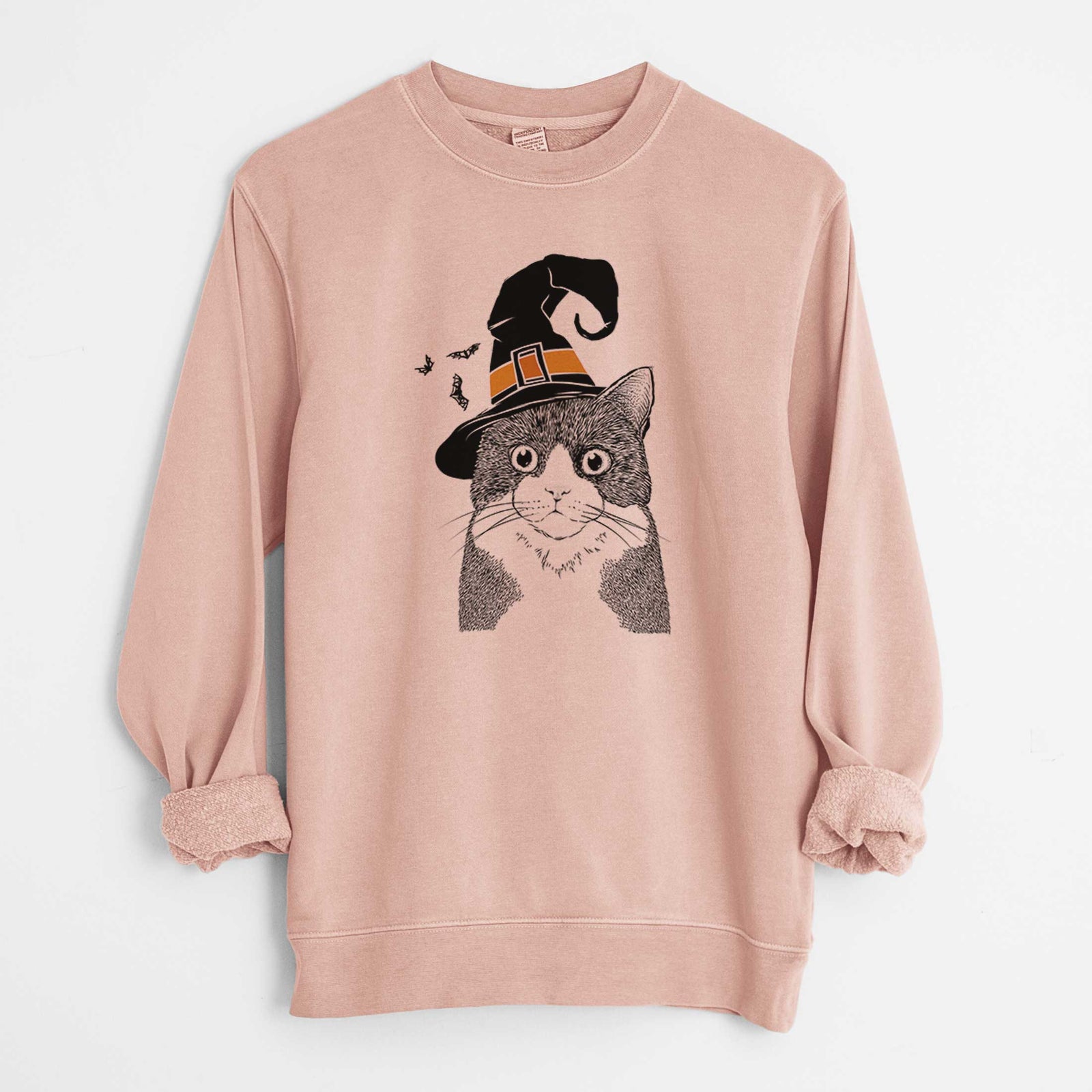 Hand-drawn sketch of Tux the Tuxedo Cat wearing a witch hat on a Dusty Pink Unisex pigment dyed crew sweatshirt