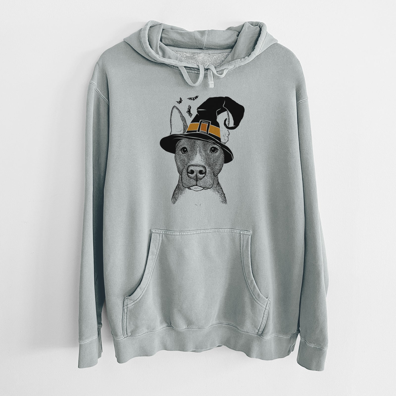 Hand-drawn sketch of Violet the Pitbull wearing a witch hat on a Sage Unisex pigment dyed hoodie