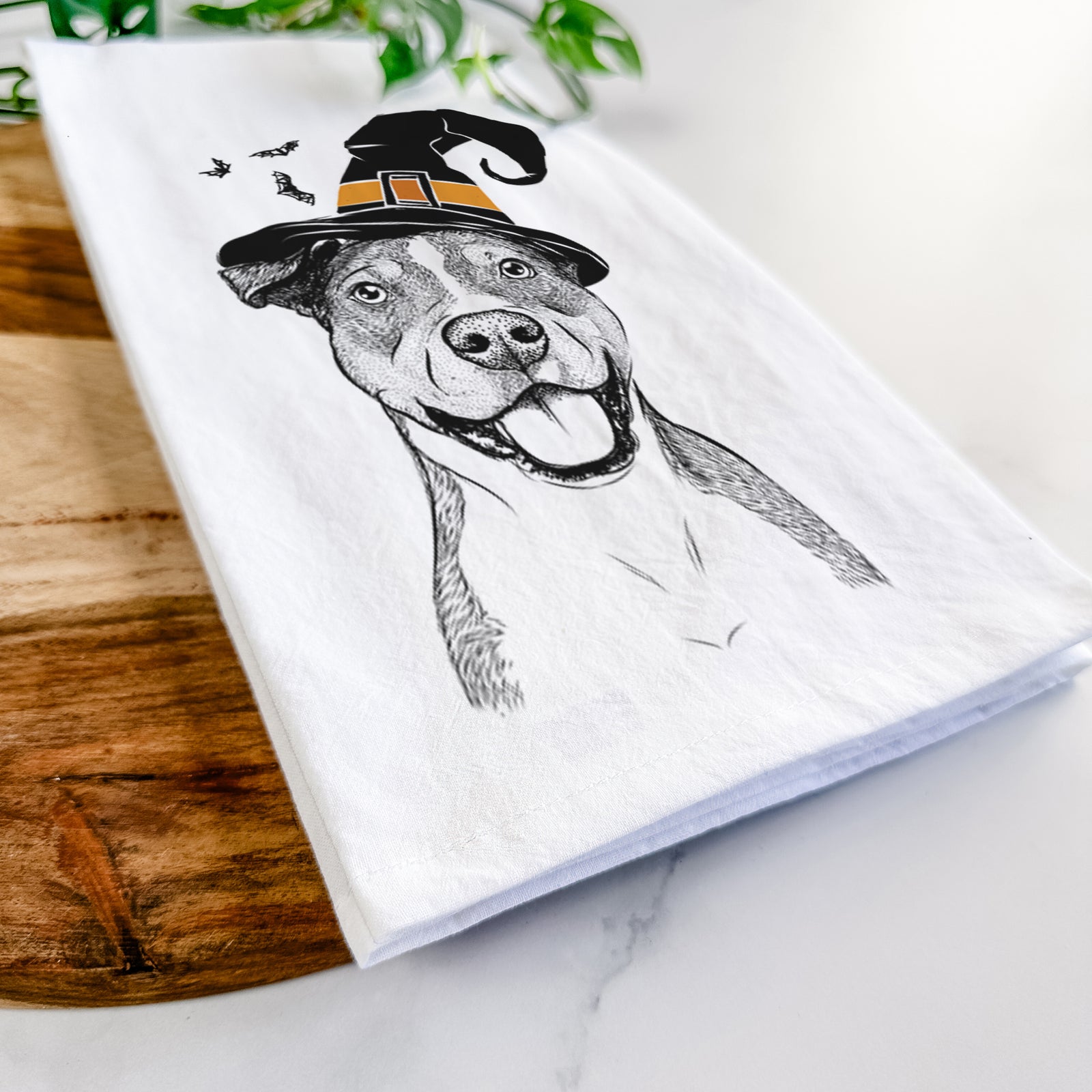 Hand-drawn sketch of Wendy the Mixed Breed wearing a witch hat on a tea towel