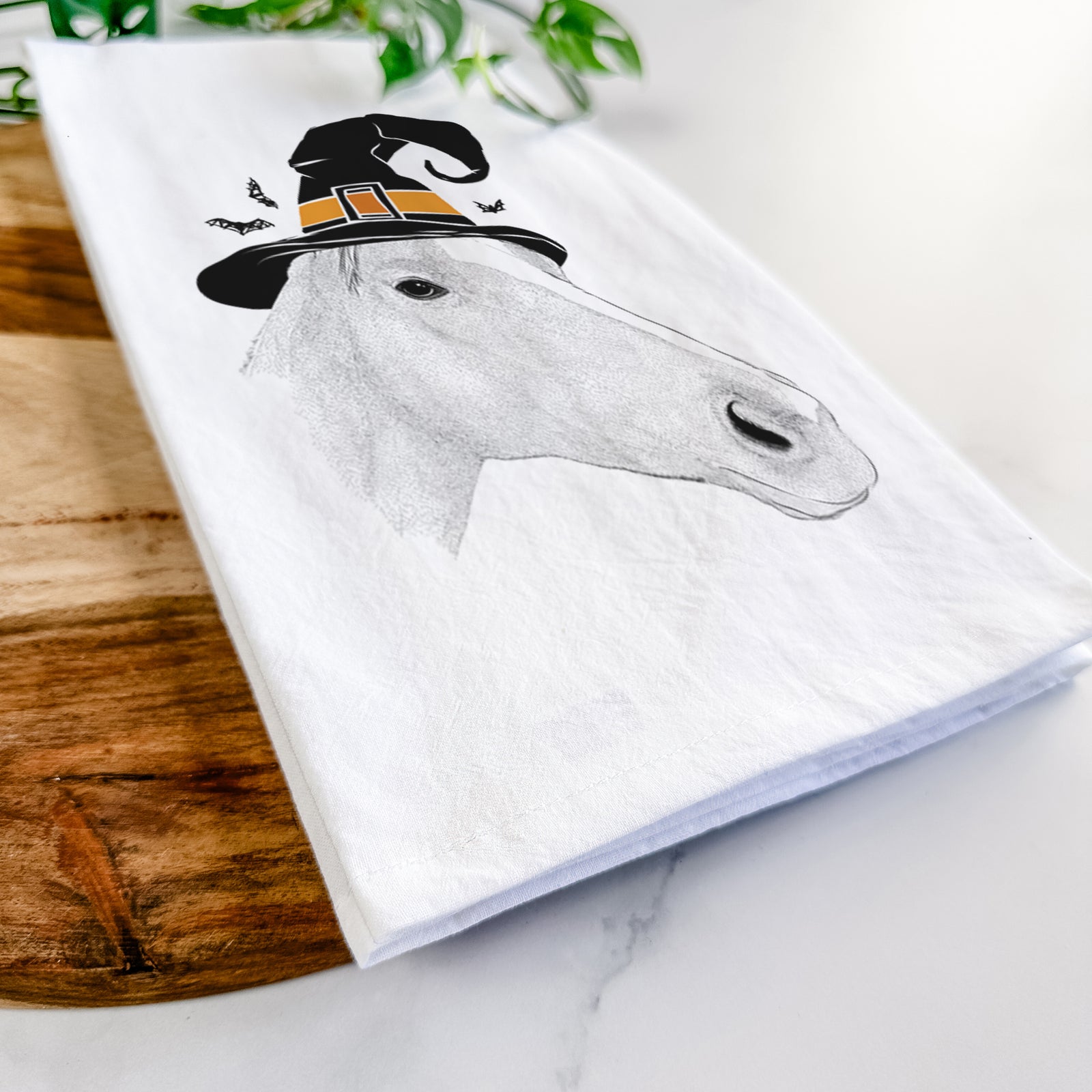 Hand-drawn sketch of Westley the Horse wearing a witch hat on a tea towel