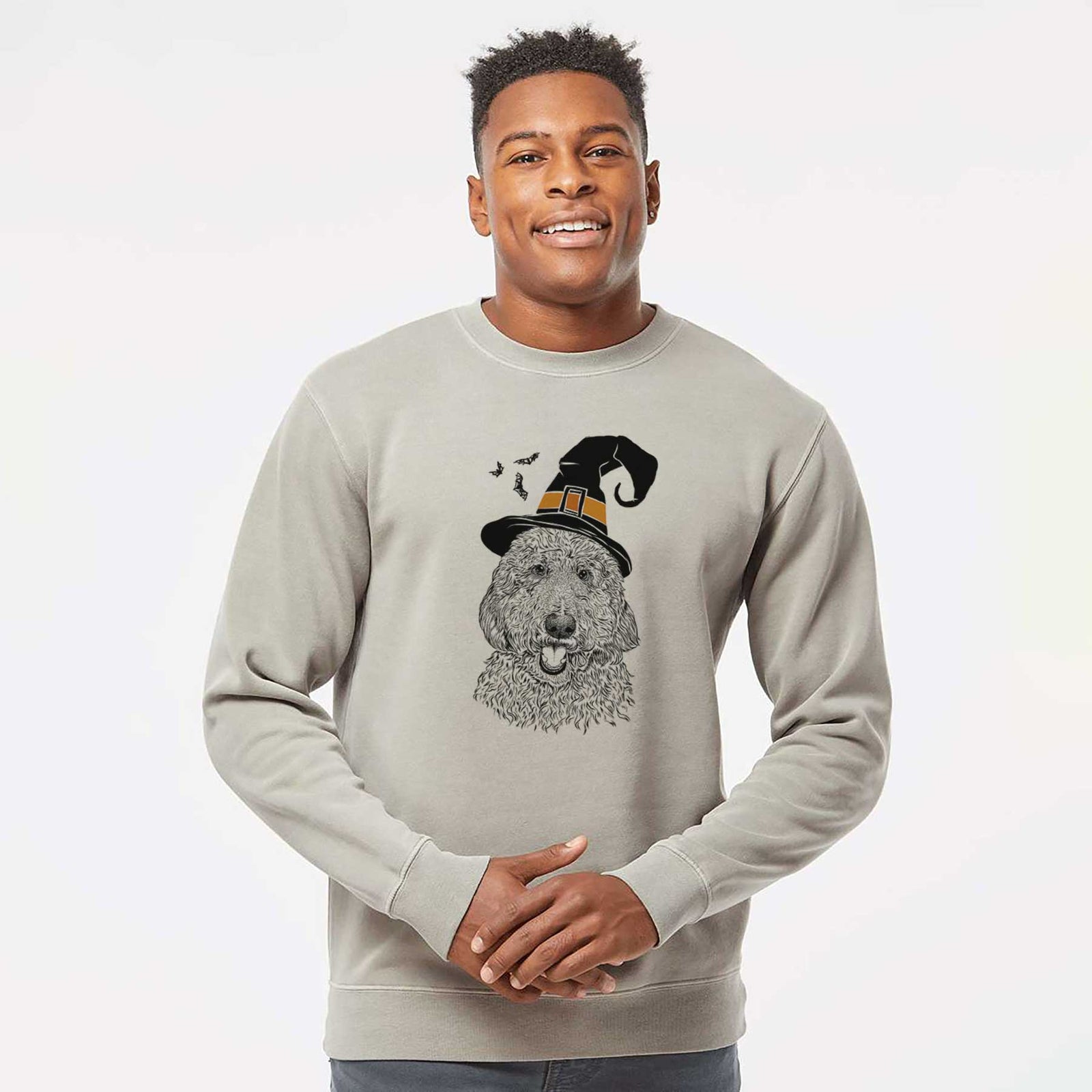 Hand-drawn sketch of Whisper the Goldendoodle wearing a witch hat on a Cement Unisex pigment dyed crew sweatshirt