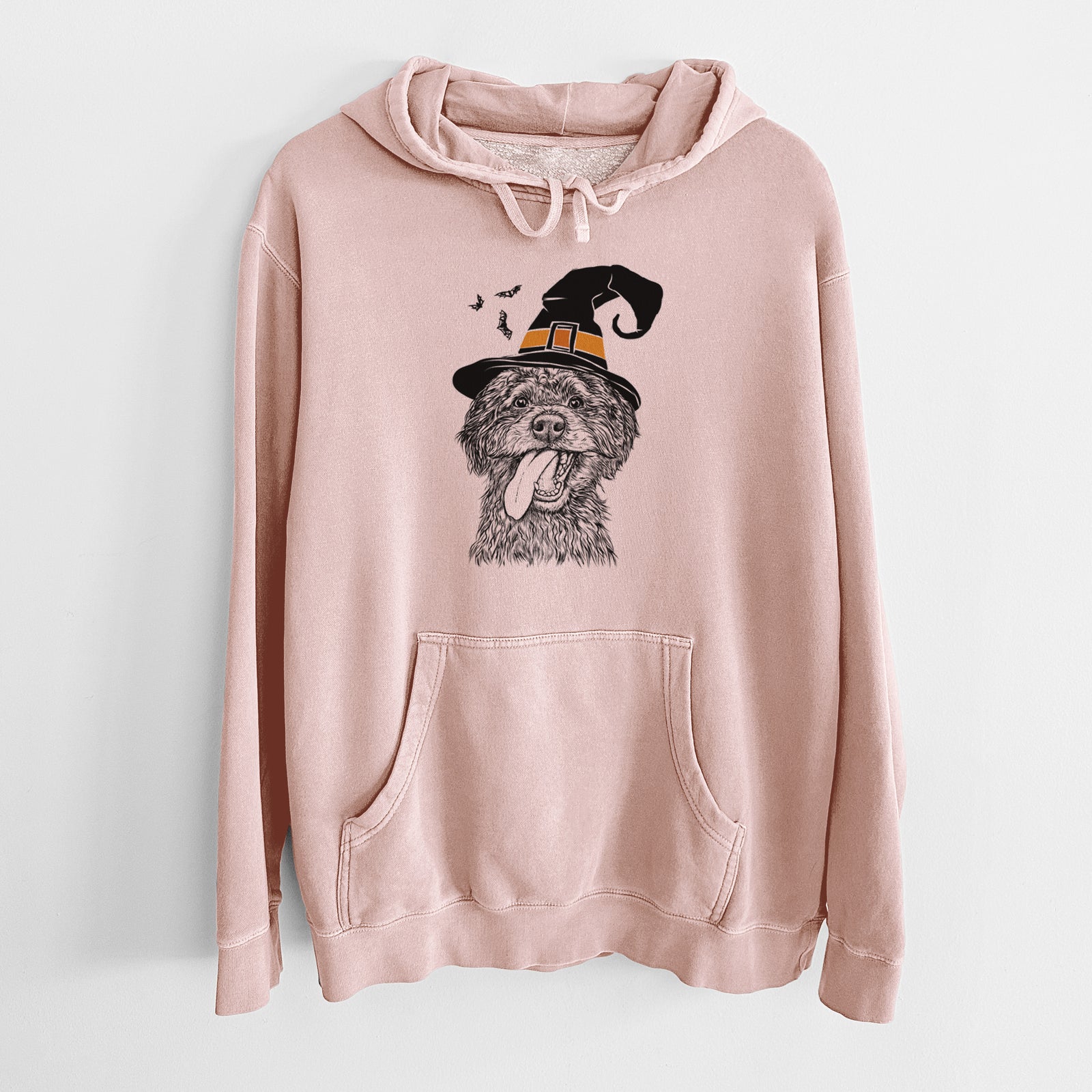 Hand-drawn sketch of Winnie the Mini Aussiedoodle wearing a witch hat on a Dusty Pink Unisex pigment dyed hoodie