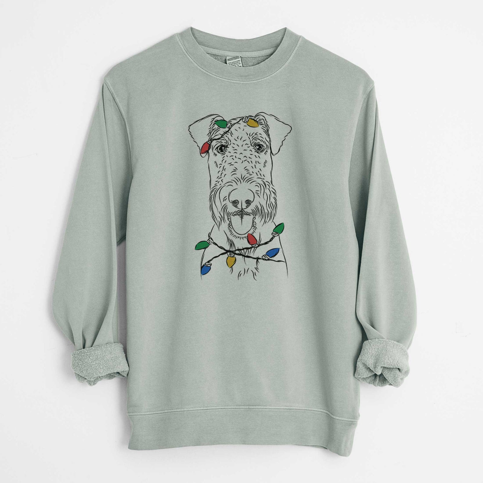 Hand-drawn sketch of Andy the Airedale Terrier wrapped in Christmas lights on a Sage Unisex pigment dyed crew sweatshirt
