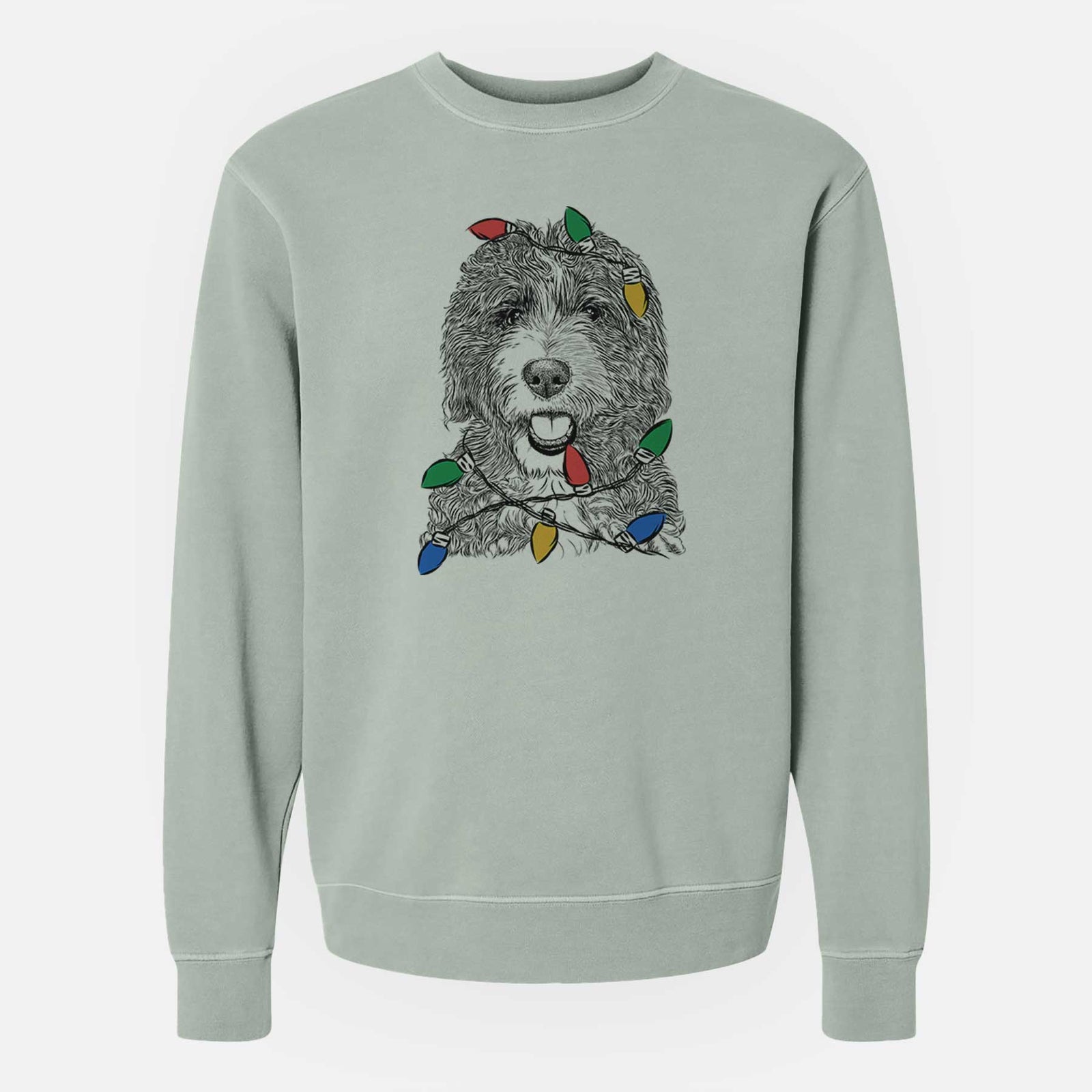 Hand-drawn sketch of Bash the Bernedoodle wrapped in Christmas lights on a Sage Unisex pigment dyed crew sweatshirt