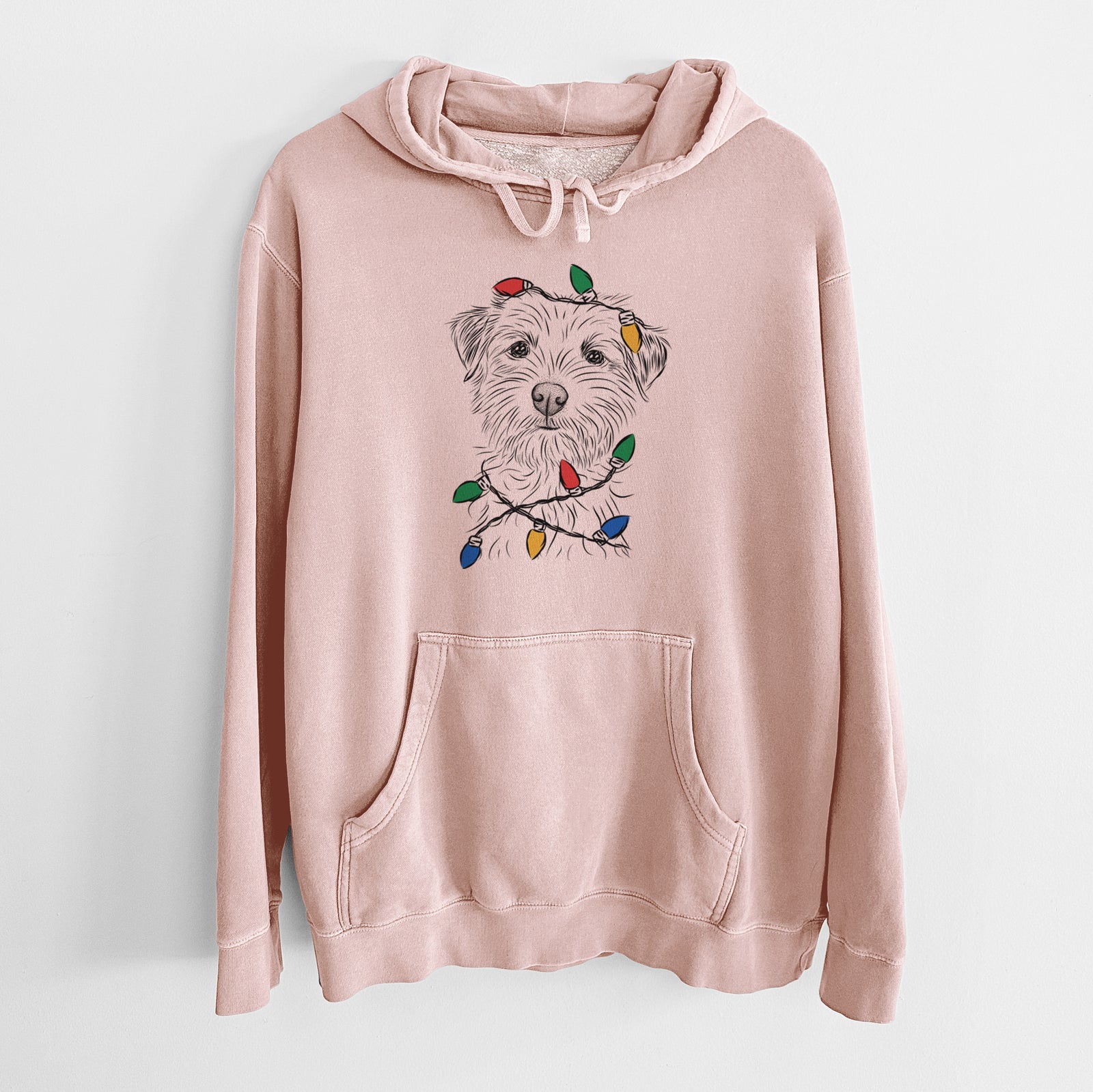 Hand-drawn sketch of Benjamin the Border Terrier wrapped in Christmas lights on a Dusty Pink Unisex pigment dyed hoodie