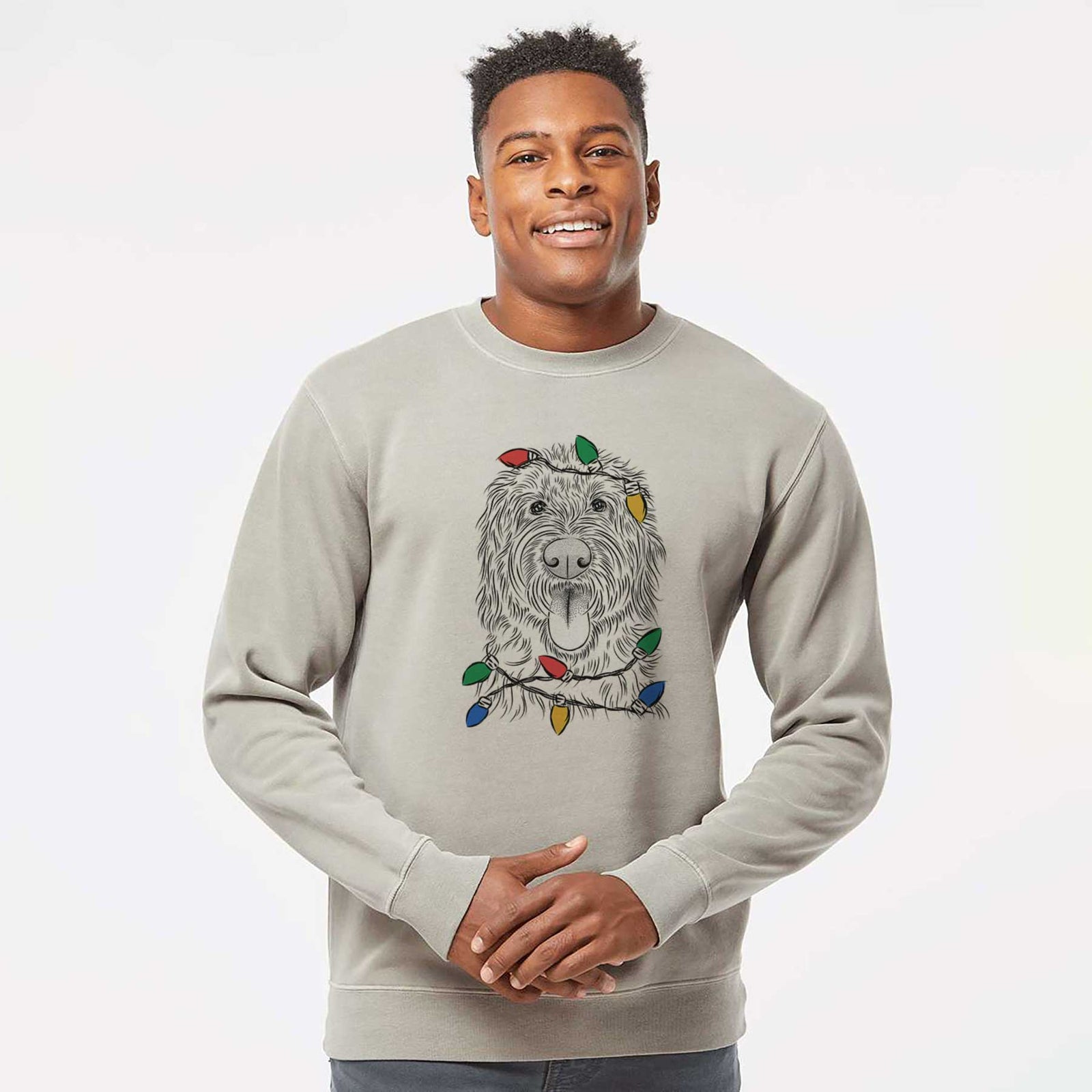 Hand-drawn sketch of Bennett the Doodle wrapped in Christmas lights on a Cement Unisex pigment dyed crew sweatshirt