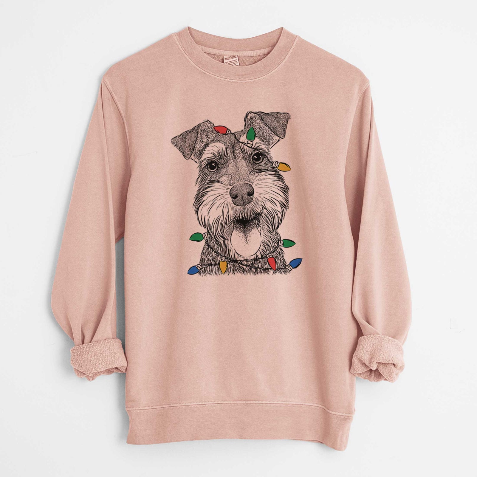 Hand-drawn sketch of Bernadette the Mini Schnauzer wrapped in Christmas lights on a Dusty Pink Unisex pigment dyed crew sweatshirt