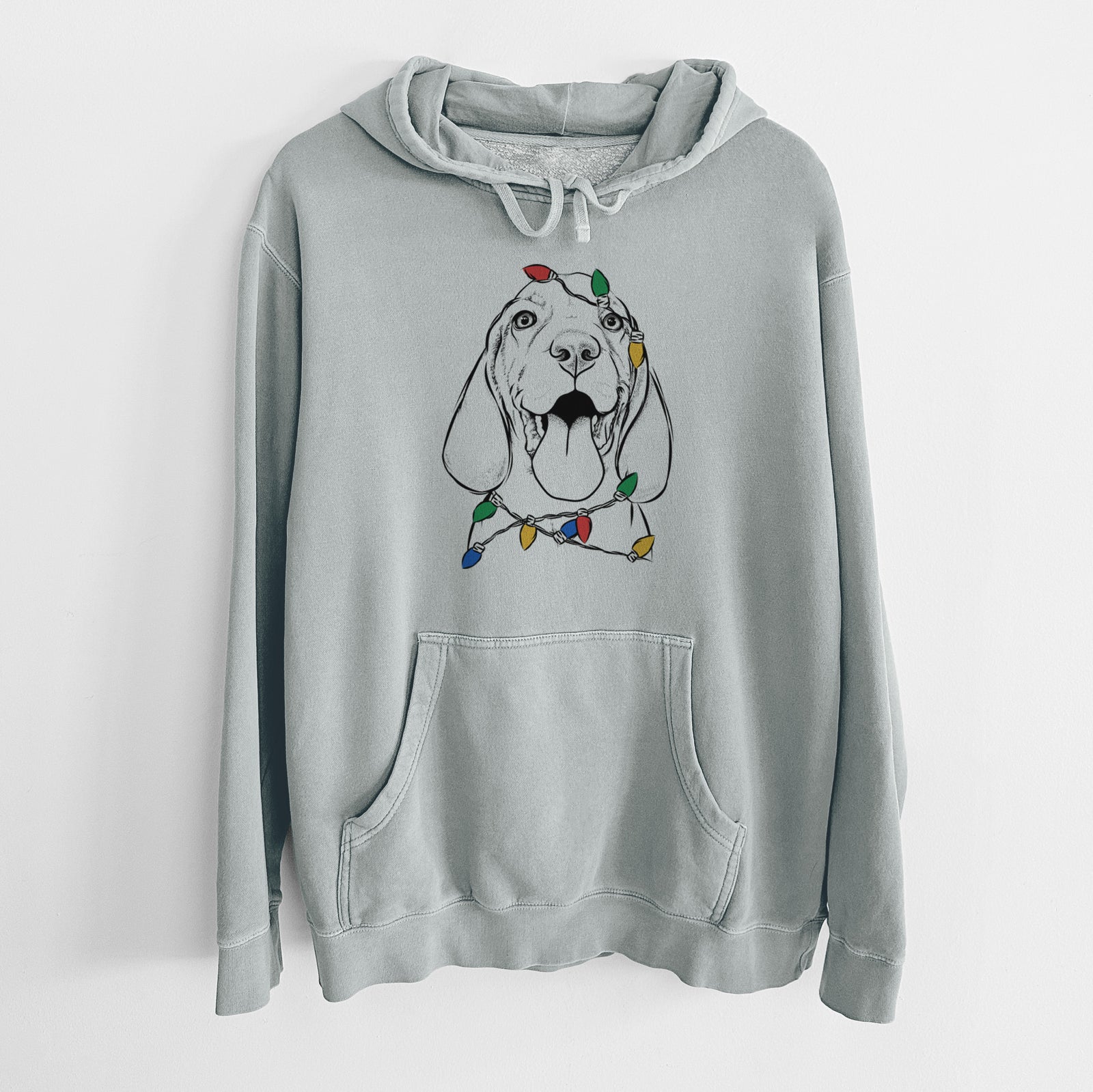 Hand-drawn sketch of Bodi the Vizsla wrapped in Christmas lights on a Sage Unisex pigment dyed hoodie
