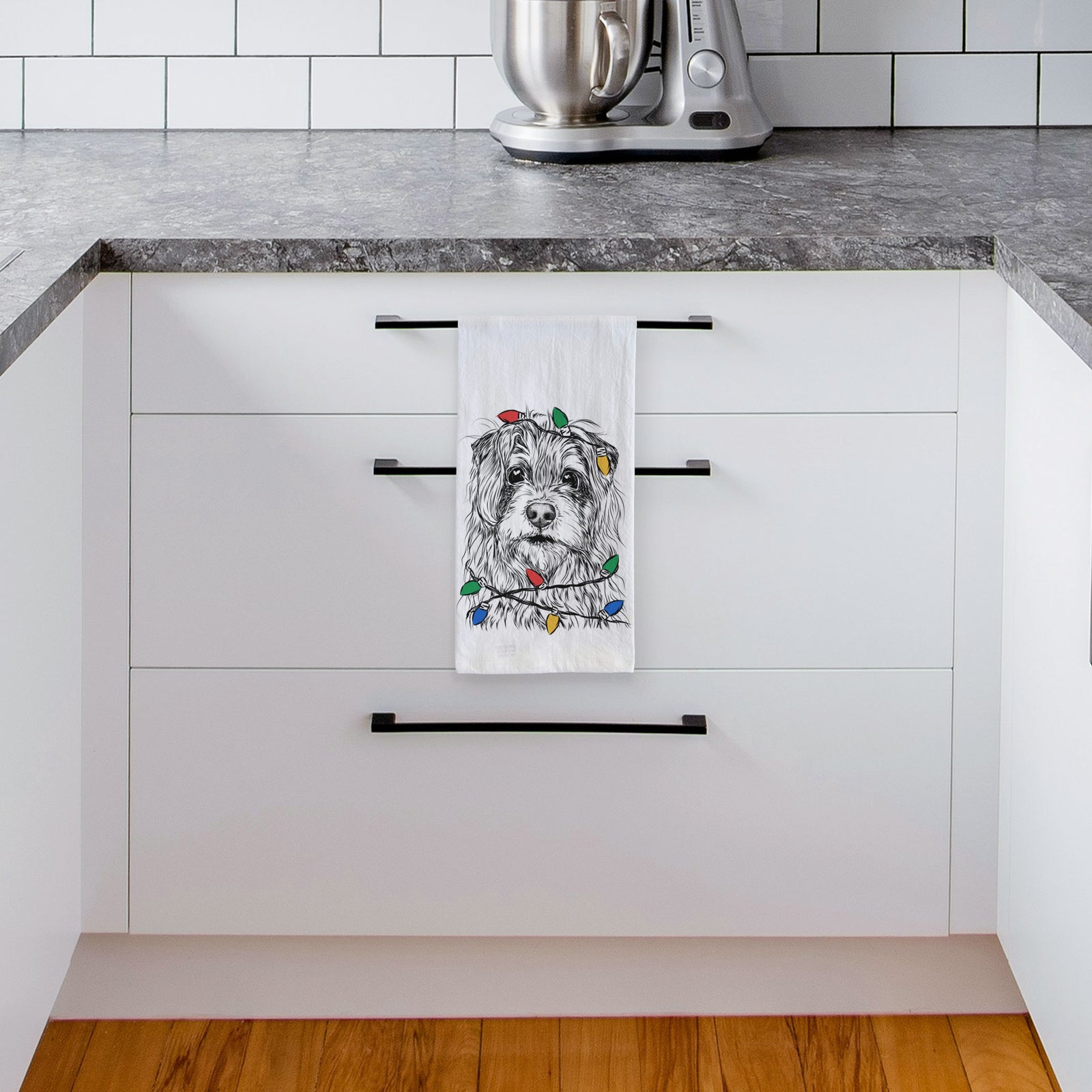 Hand-drawn sketch of Chester the Terrier Mix wrapped in Christmas lights on a tea towel, hanging on an oven door in a kitchen