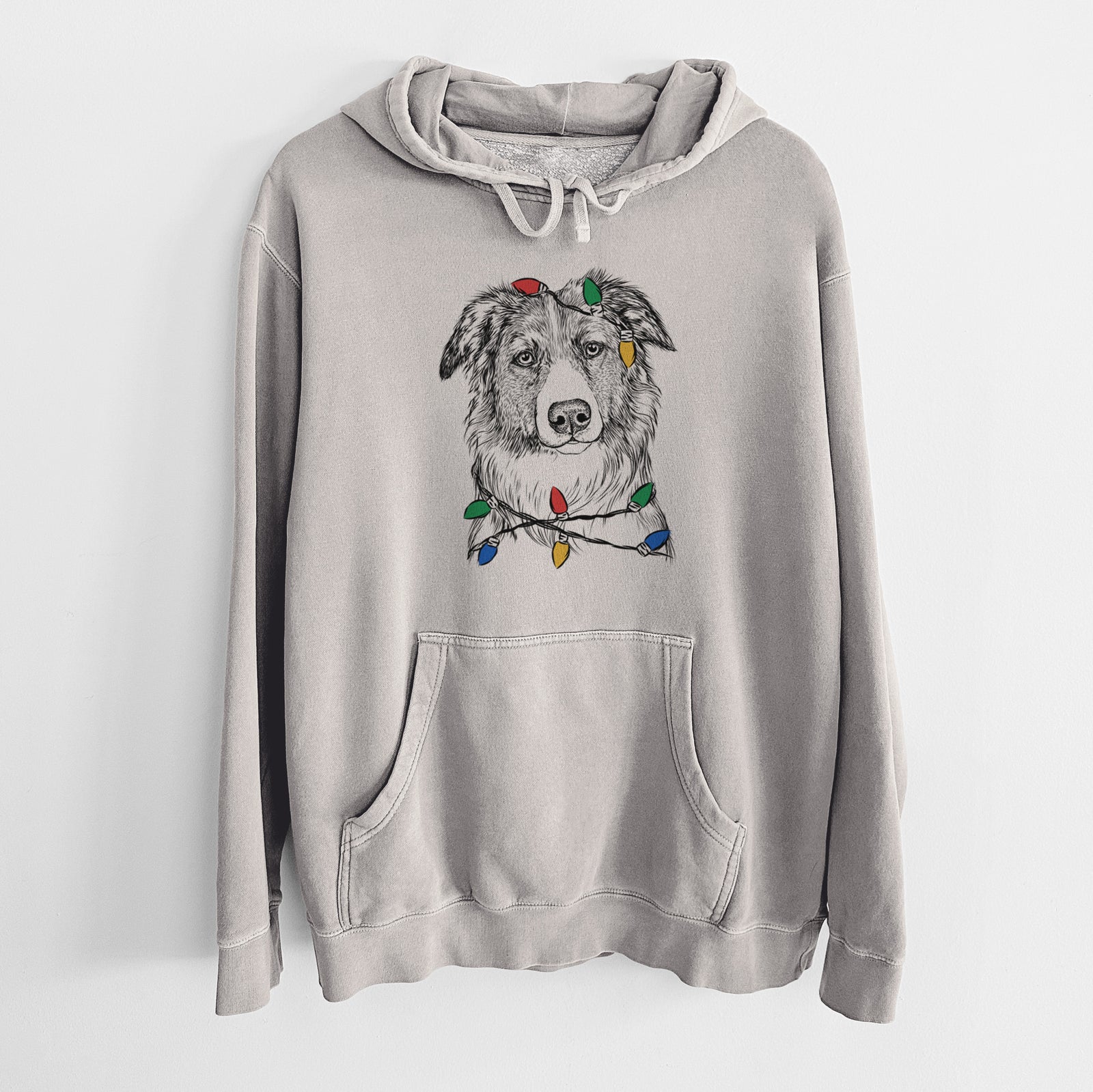 Hand-drawn sketch of Cynder the English Shepherd wrapped in Christmas lights on a Cement Unisex pigment dyed hoodie