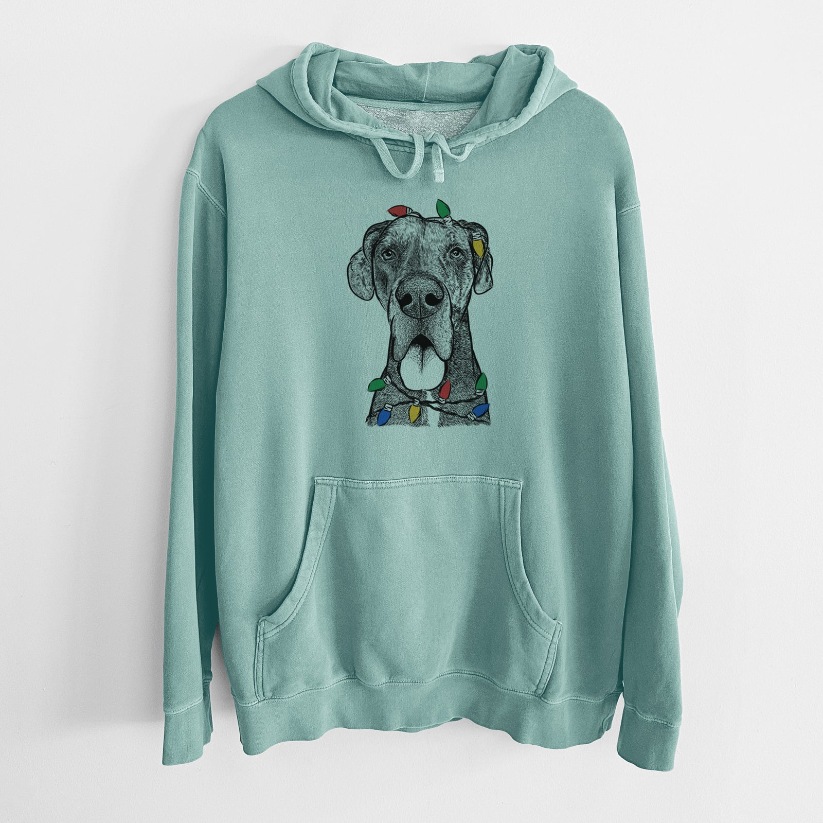 Hand-drawn sketch of Eli the Great Dane wrapped in Christmas lights on a Mint Unisex pigment dyed hoodie
