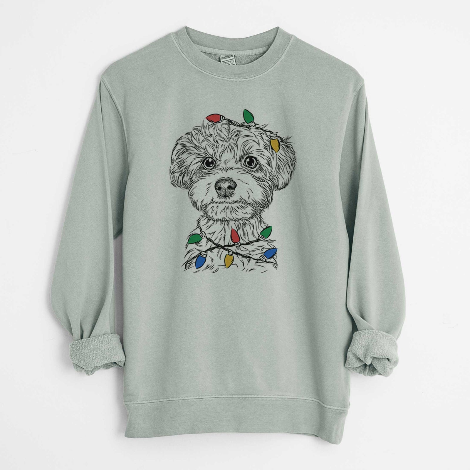 Hand-drawn sketch of Elliott the Yorkiepoo wrapped in Christmas lights on a Sage Unisex pigment dyed crew sweatshirt