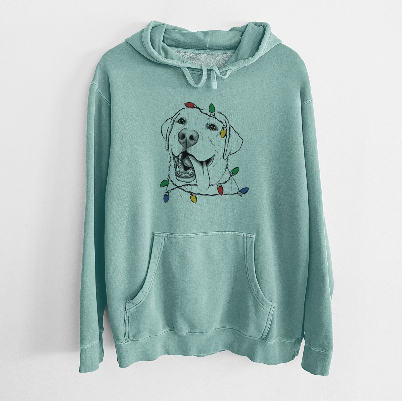 Hand-drawn sketch of Finn the Labrador Retriever wrapped in Christmas lights on a Mint Unisex pigment dyed hoodie