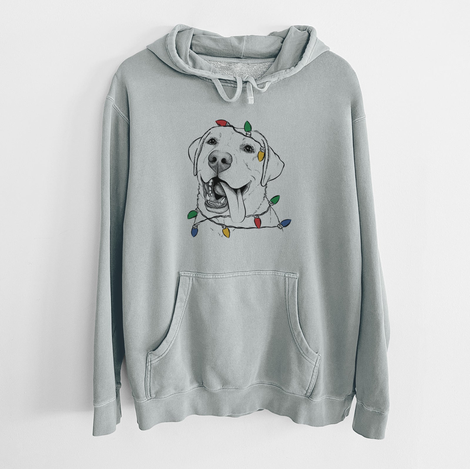 Hand-drawn sketch of Finn the Labrador Retriever wrapped in Christmas lights on a Sage Unisex pigment dyed hoodie