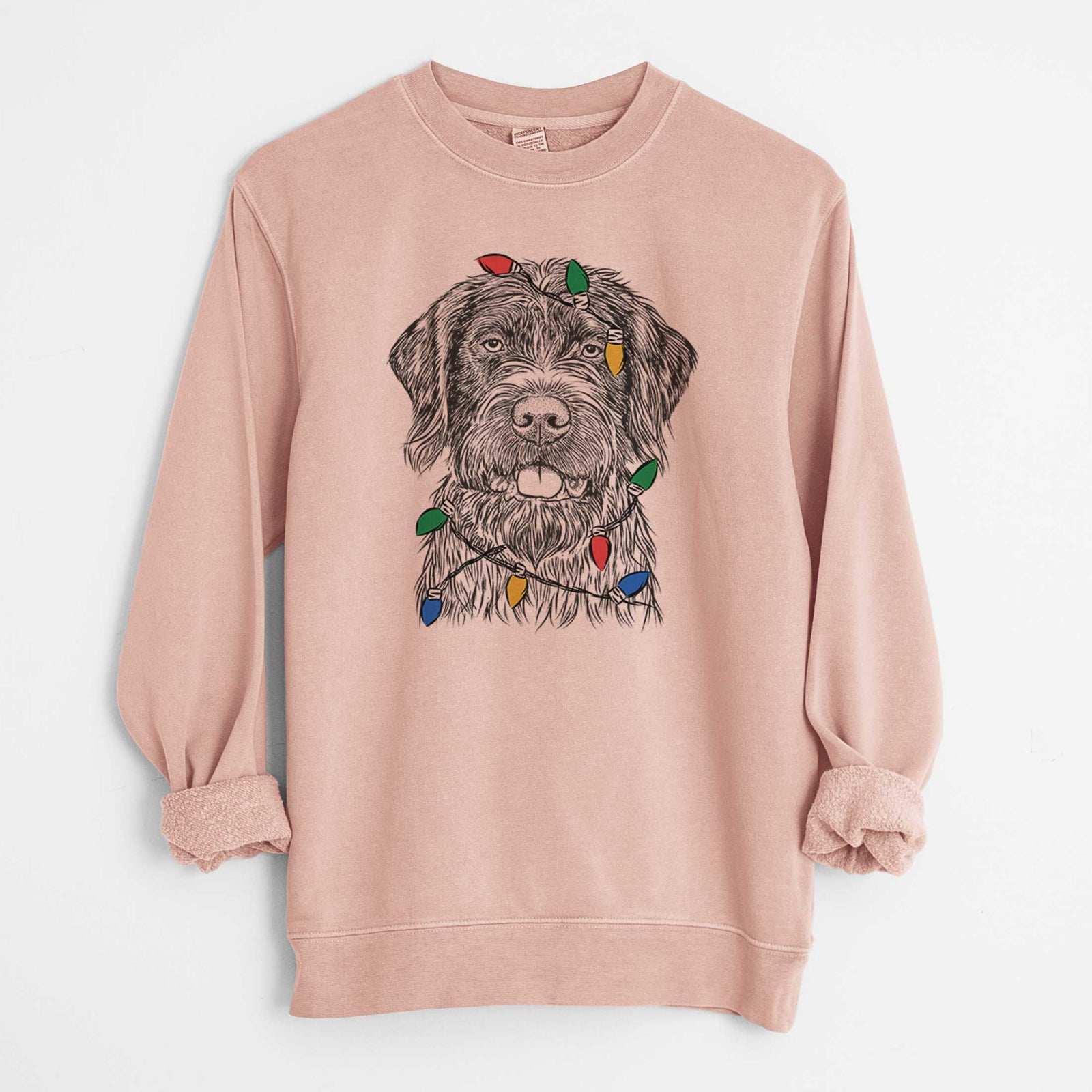 Hand-drawn sketch of Fletcher the Wirehaired Pointing Griffon wrapped in Christmas lights on a Dusty Pink Unisex pigment dyed crew sweatshirt