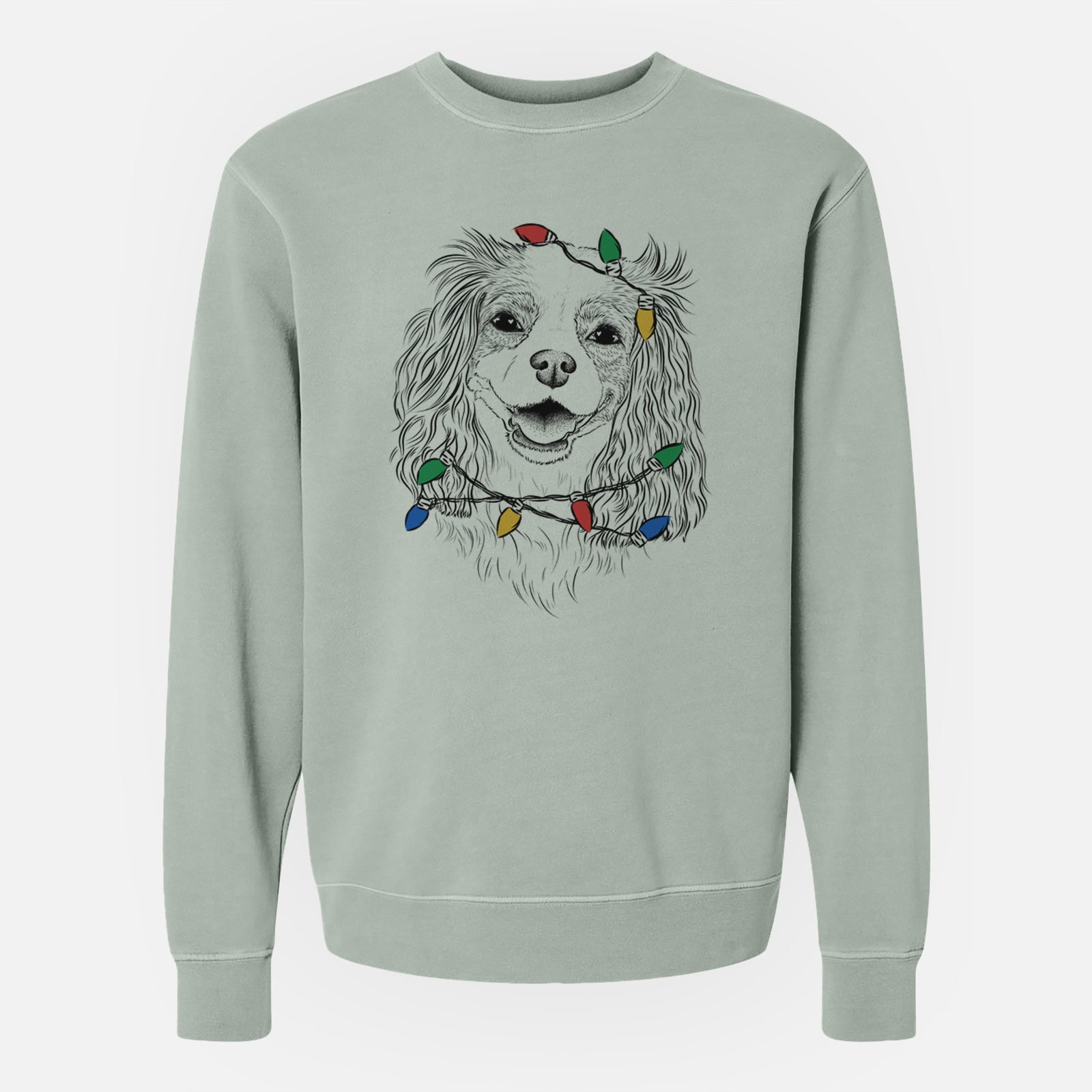 Hand-drawn sketch of Halley Comet the Cavalier King Charles Spaniel wrapped in Christmas lights on a Sage Unisex pigment dyed crew sweatshirt