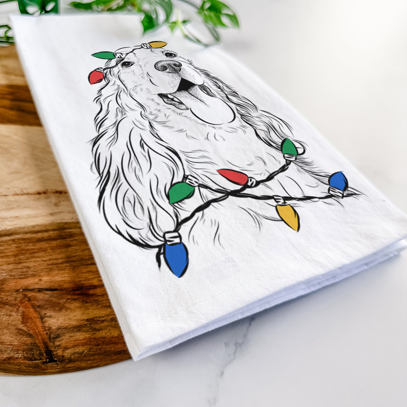 Hand-drawn sketch of Happy Henry the English Cocker Spaniel wrapped in Christmas lights on a tea towel