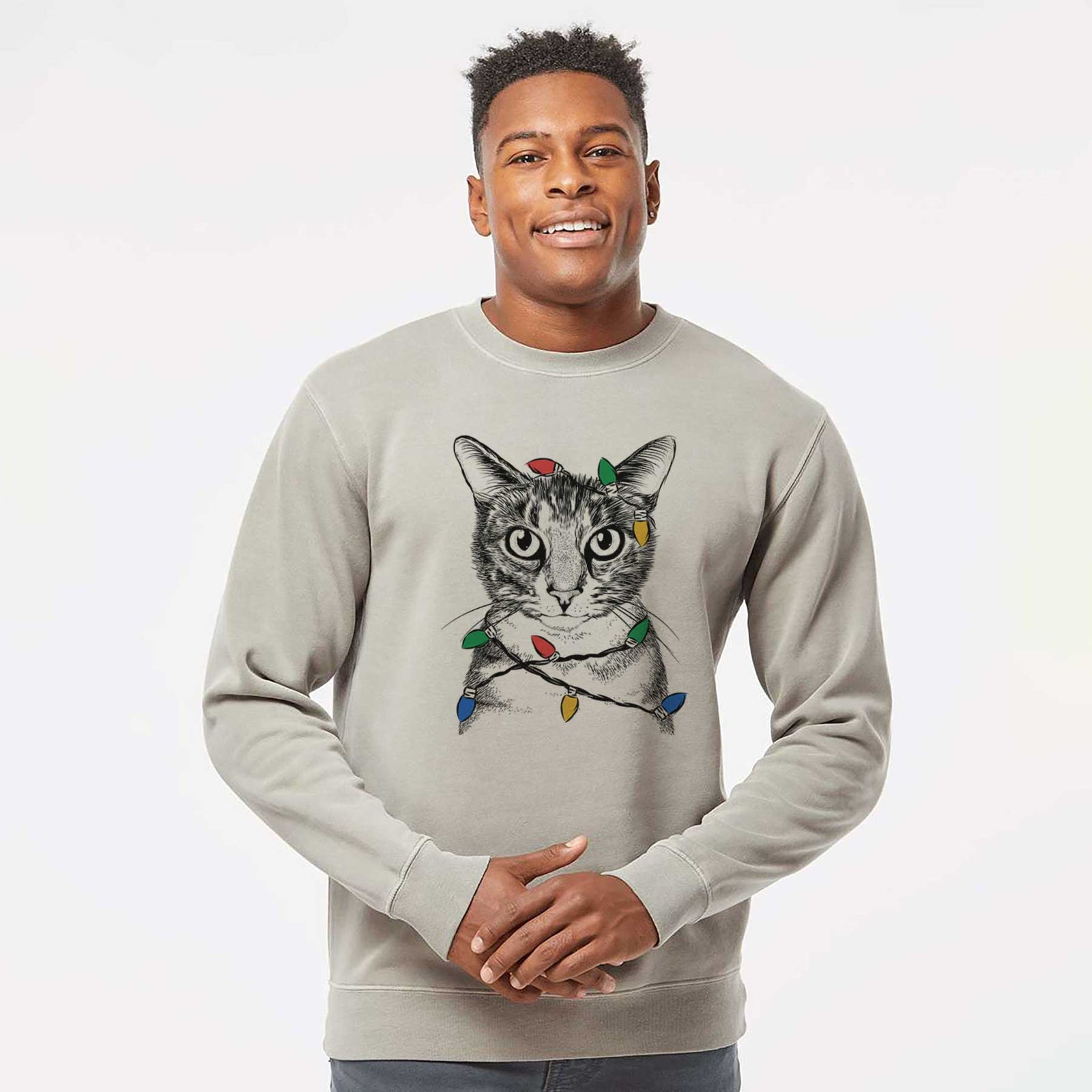 Hand-drawn sketch of Hobbes the Tabby Cat wrapped in Christmas lights on a Cement Unisex pigment dyed crew sweatshirt