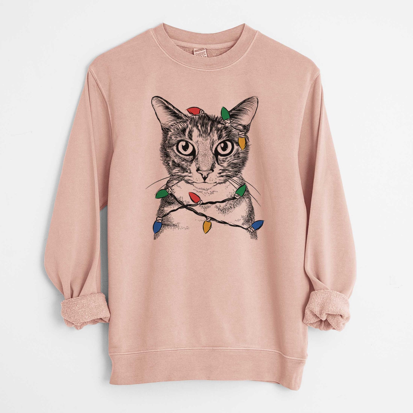 Hand-drawn sketch of Hobbes the Tabby Cat wrapped in Christmas lights on a Dusty Pink Unisex pigment dyed crew sweatshirt