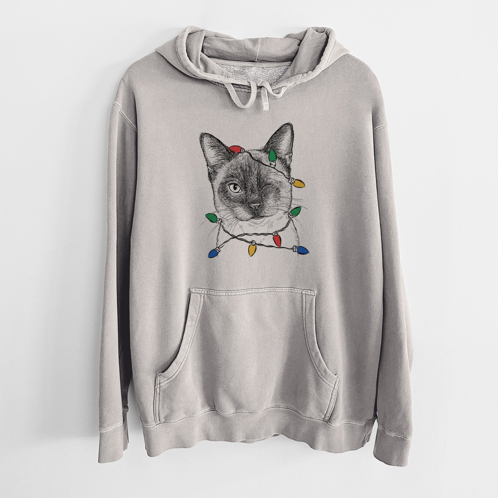 Hand-drawn sketch of Hoggle the Siamese Cat wrapped in Christmas lights on a Cement Unisex pigment dyed hoodie