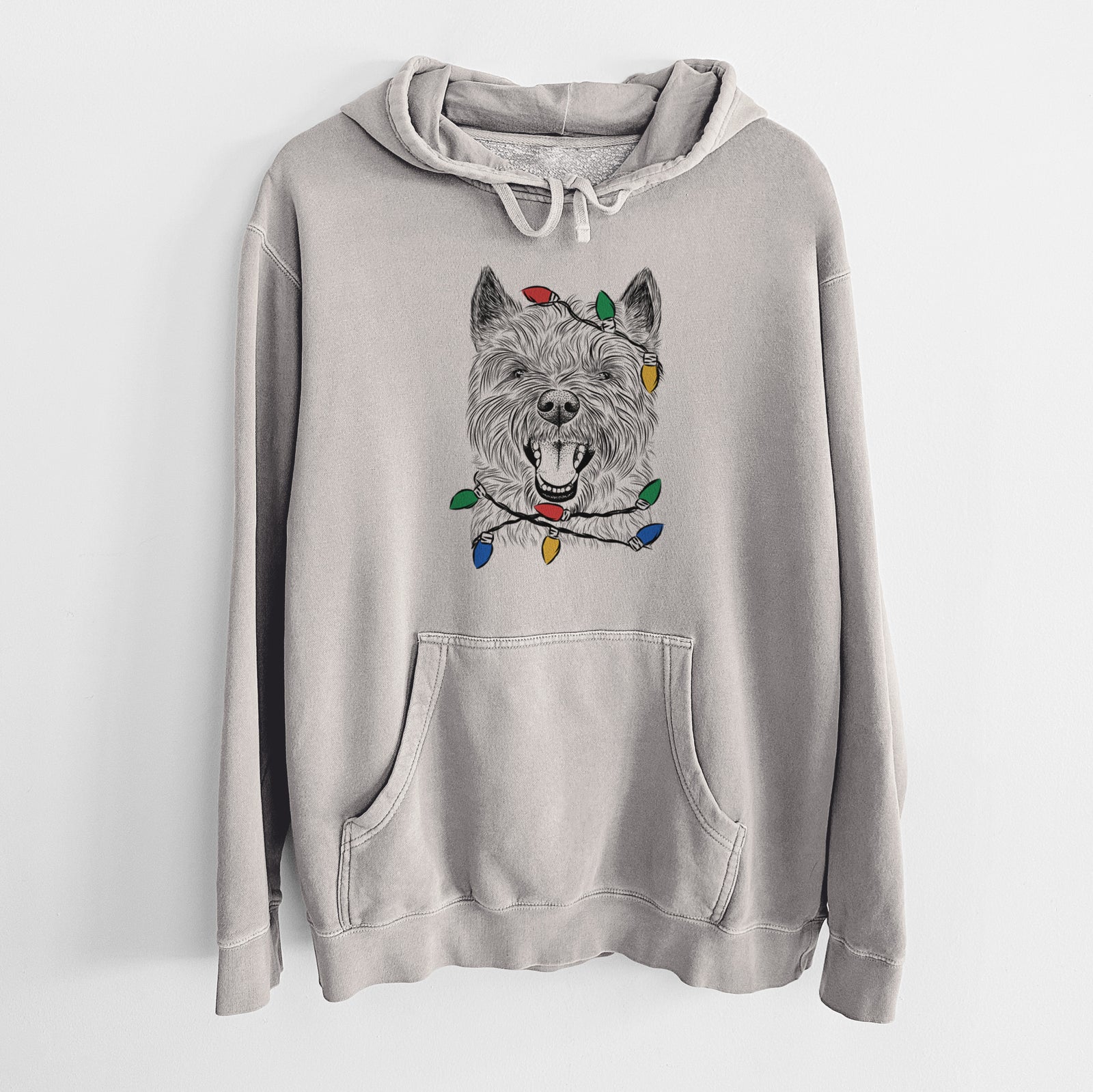 Hand-drawn sketch of Jeff the Cairn Terrier wrapped in Christmas lights on a Cement Unisex pigment dyed hoodie