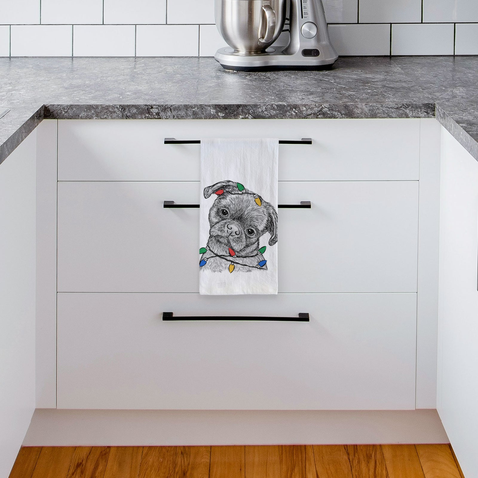 Hand-drawn sketch of Koko the Shih Tzu wrapped in Christmas lights on a tea towel, hanging on an oven door in a kitchen