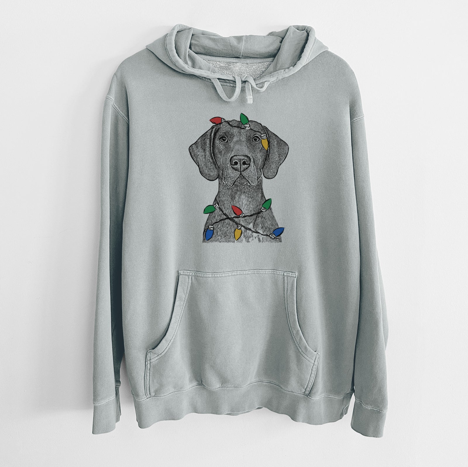 Hand-drawn sketch of Lucifer the German Shorthaired Pointer wrapped in Christmas lights on a Sage Unisex pigment dyed hoodie