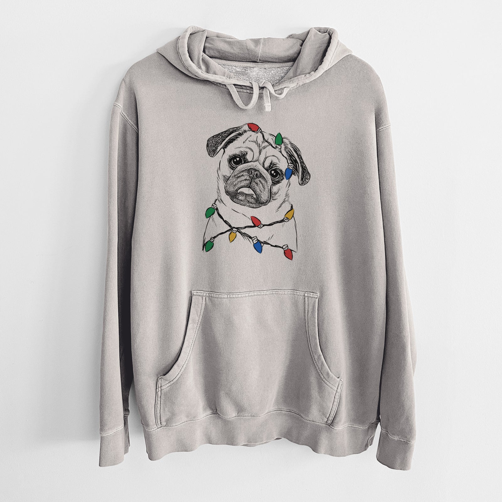 Hand-drawn sketch of Macy the Pug wrapped in Christmas lights on a Cement Unisex pigment dyed hoodie