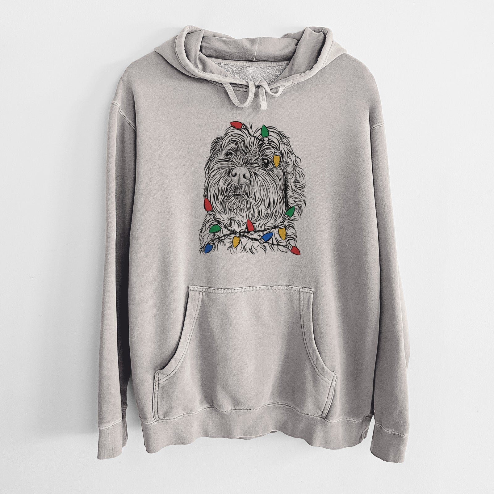 Hand-drawn sketch of Maggie Girl the Cockapoo wrapped in Christmas lights on a Cement Unisex pigment dyed hoodie