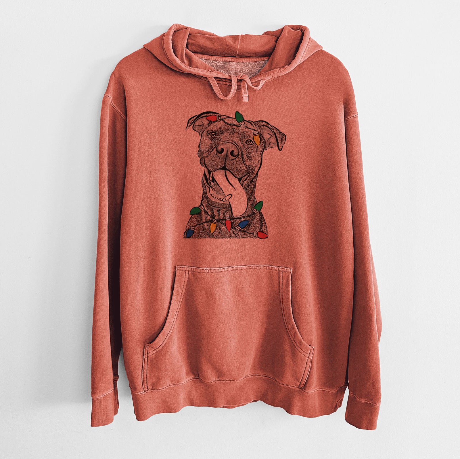 Hand-drawn sketch of Mikey the Boxador wrapped in Christmas lights on an Amber Unisex pigment dyed hoodie