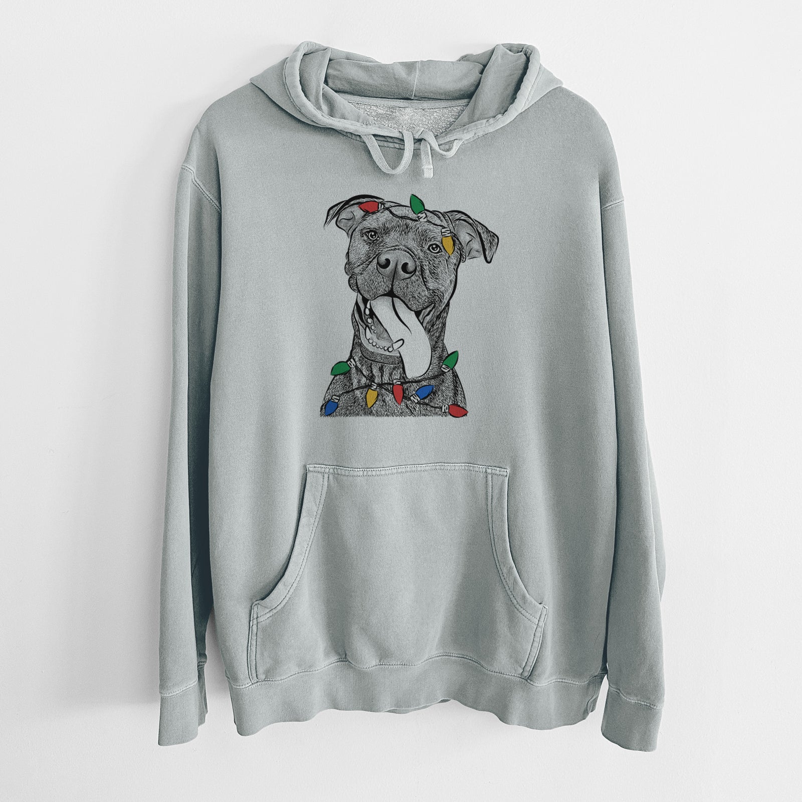 Hand-drawn sketch of Mikey the Boxador wrapped in Christmas lights on a Sage Unisex pigment dyed hoodie