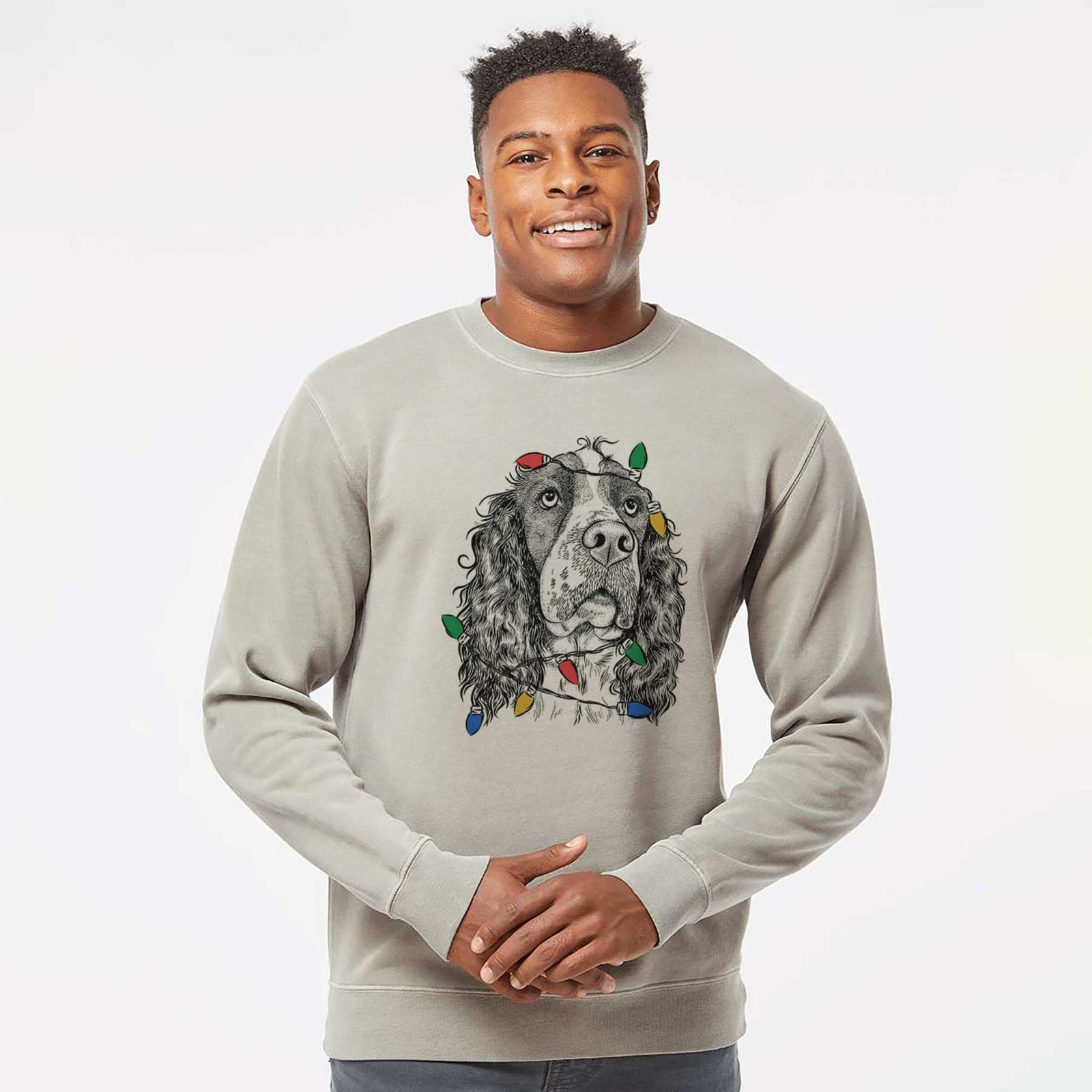 Hand-drawn sketch of Millie Mae the English Springer Spaniel wrapped in Christmas lights on a Cement Unisex pigment dyed crew sweatshirt