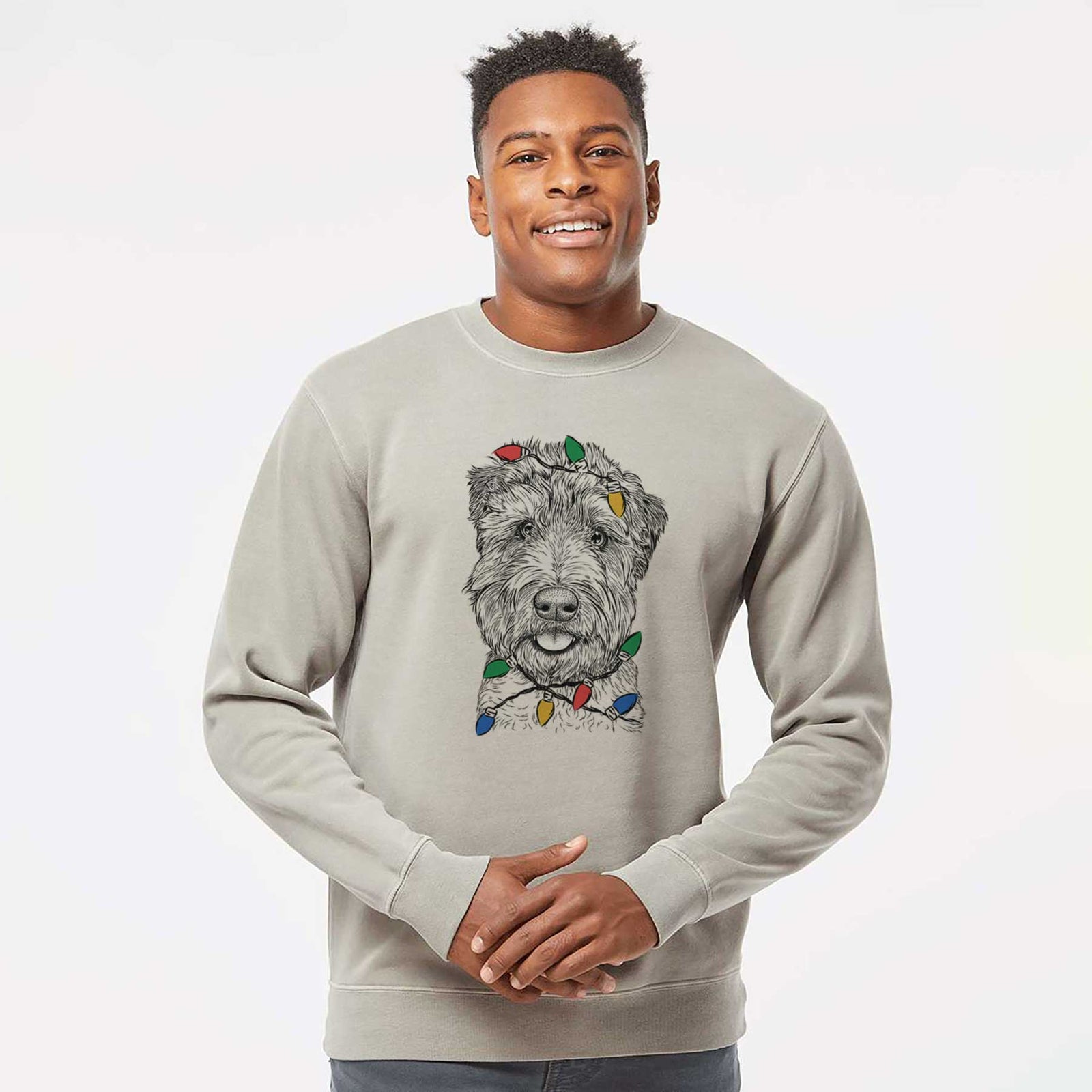 Hand-drawn sketch of Milton the Soft Coated Wheaten Terrier wrapped in Christmas lights on a Cement Unisex pigment dyed crew sweatshirt