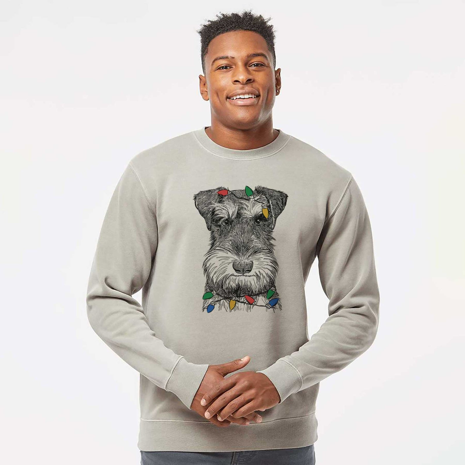 Hand-drawn sketch of Murphy the Mini Schnauzer wrapped in Christmas lights on a Cement Unisex pigment dyed crew sweatshirt