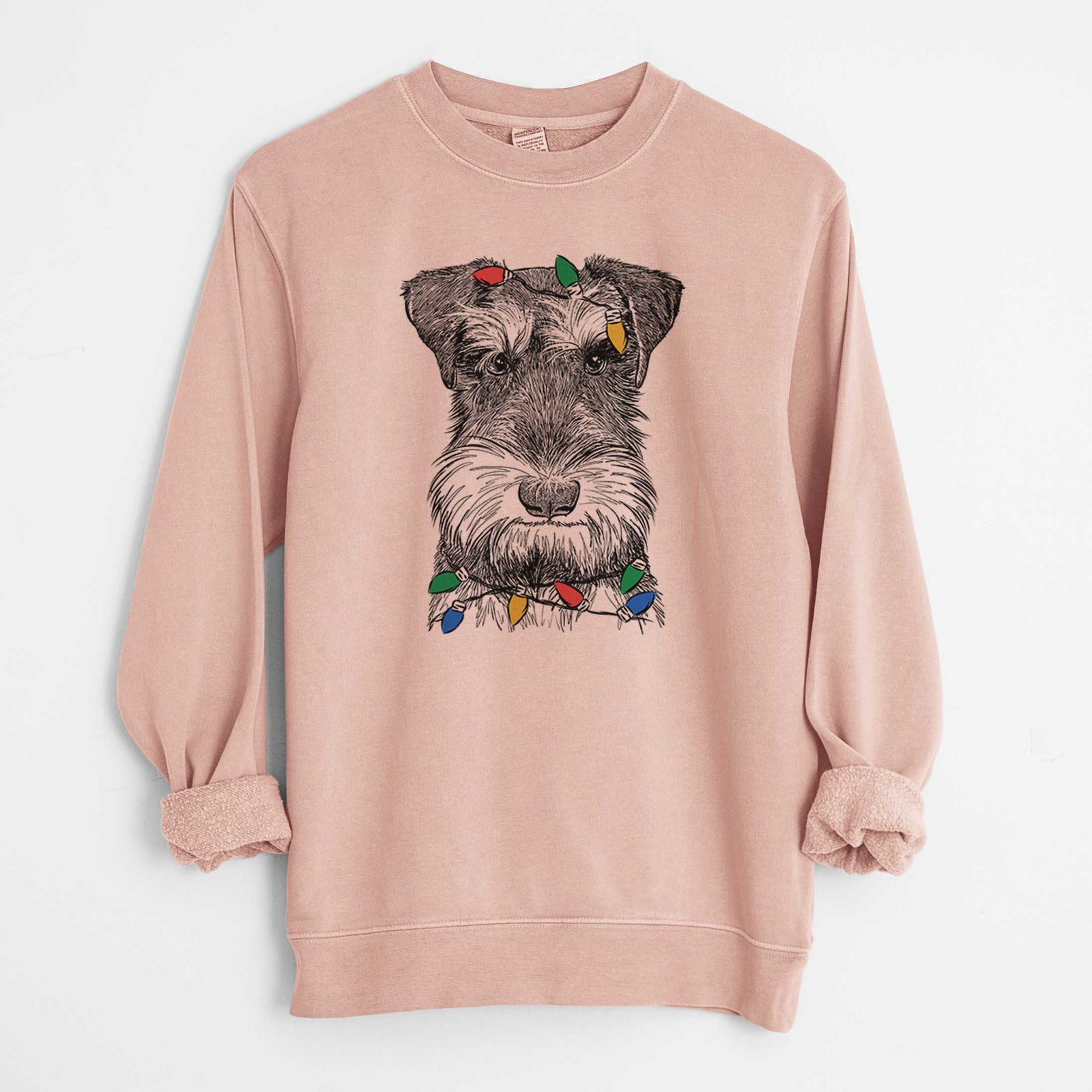 Hand-drawn sketch of Murphy the Mini Schnauzer wrapped in Christmas lights on a Dusty Pink Unisex pigment dyed crew sweatshirt