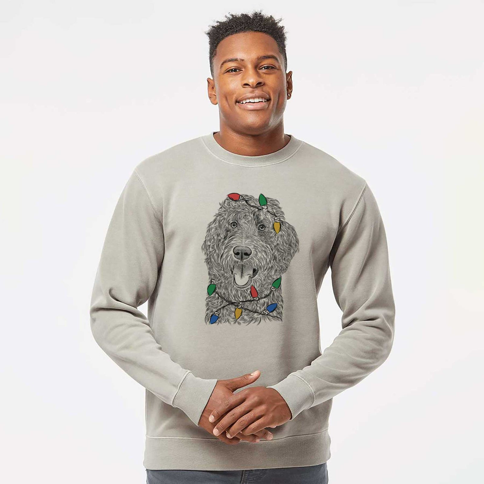 Hand-drawn sketch of Murr Dog the Labradoodle wrapped in Christmas lights on a Cement Unisex pigment dyed crew sweatshirt