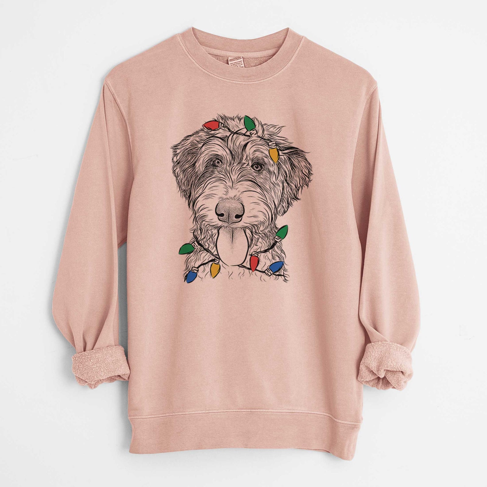 Hand-drawn sketch of Myrtle Mae the Aussiedoodle wrapped in Christmas lights on a Dusty Pink Unisex pigment dyed crew sweatshirt