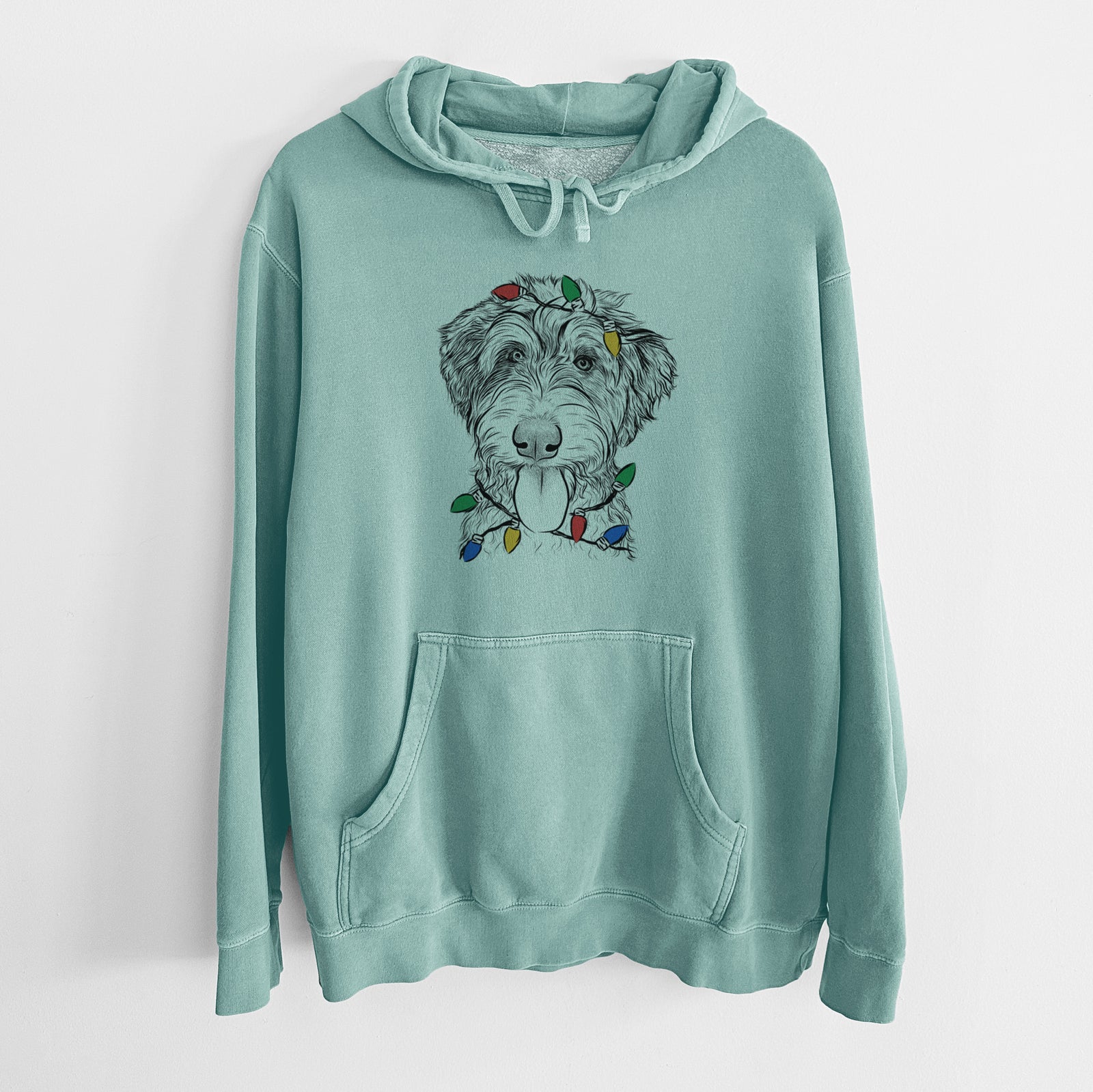 Hand-drawn sketch of Myrtle Mae the Aussiedoodle wrapped in Christmas lights on a Mint Unisex pigment dyed hoodie