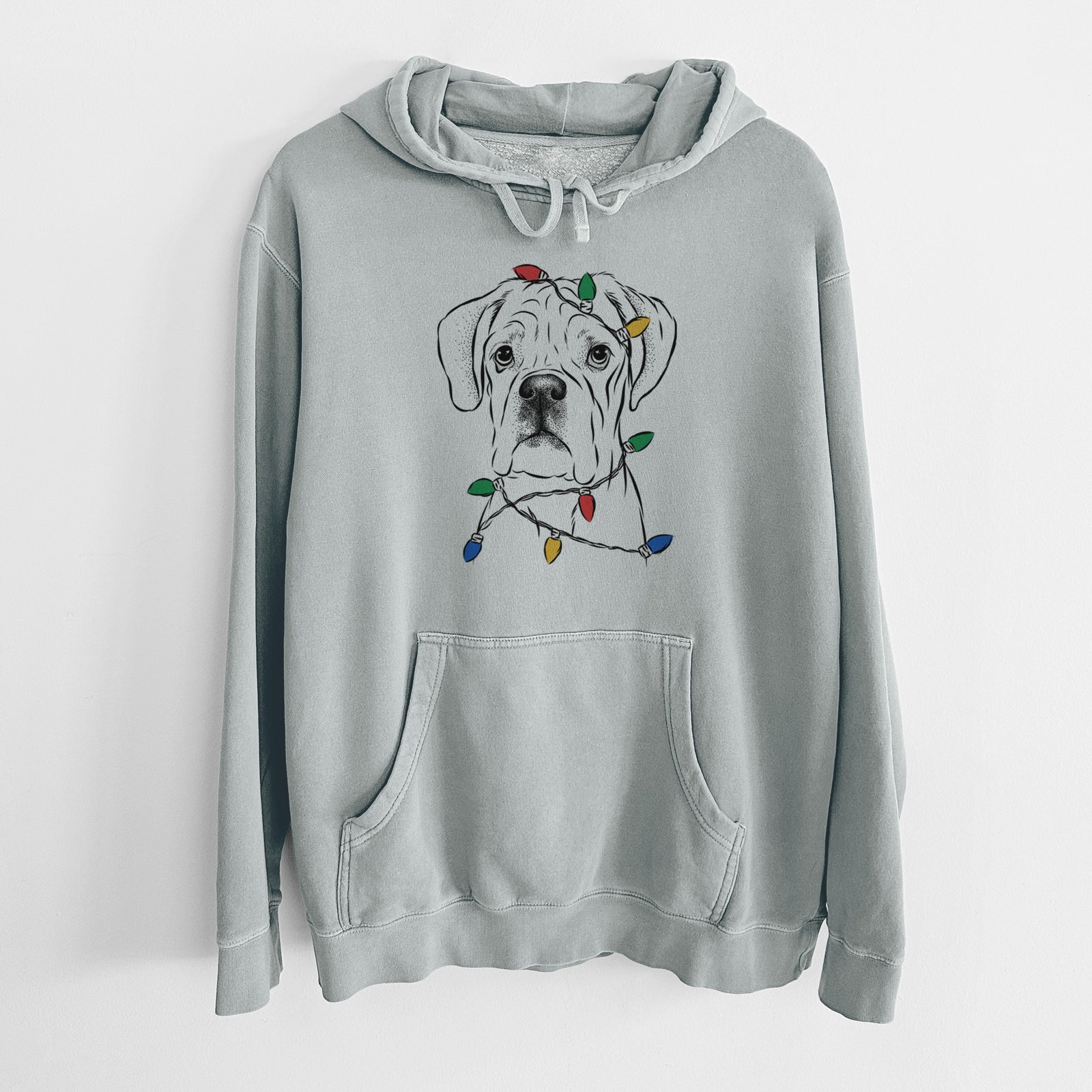 Hand-drawn sketch of Nelly the Boxer wrapped in Christmas lights on a Sage Unisex pigment dyed hoodie