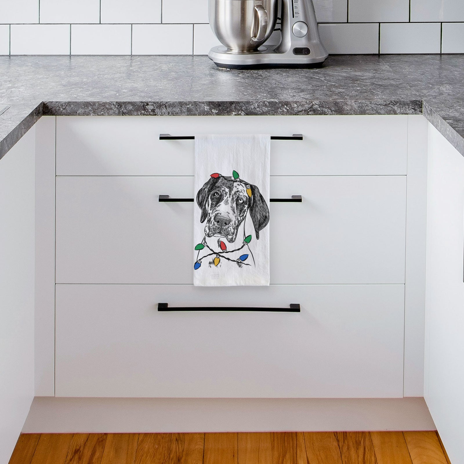Hand-drawn sketch of Nyx the Great Dane wrapped in Christmas lights on a tea towel, hanging on an oven door in a kitchen
