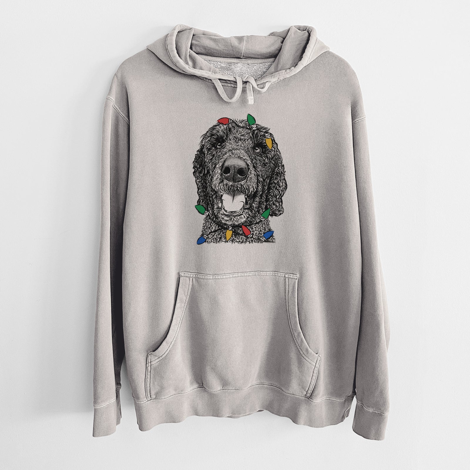 Hand-drawn sketch of Obi James the Goldendoodle wrapped in Christmas lights on a Cement Unisex pigment dyed hoodie