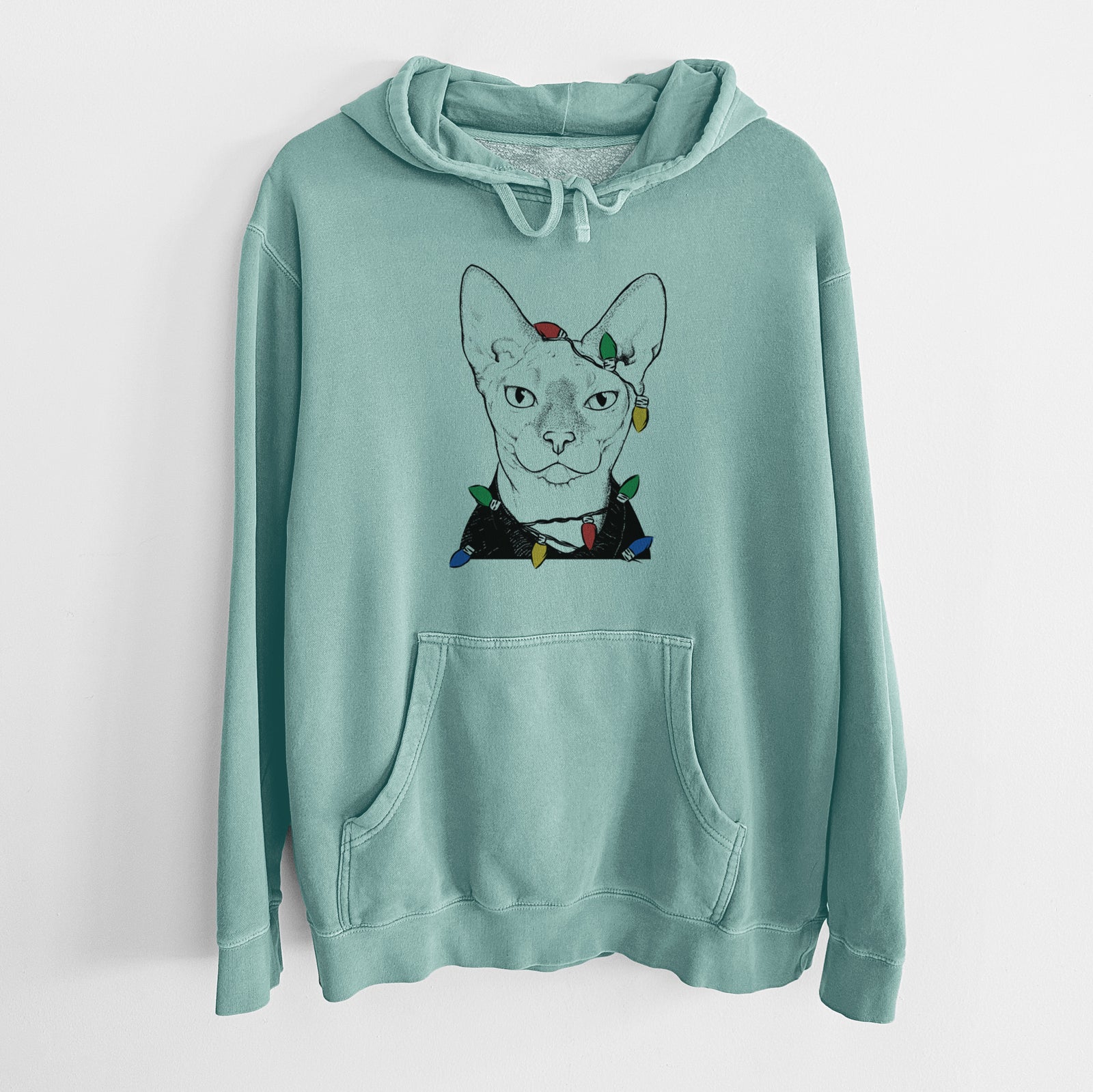 Hand-drawn sketch of Oliver Watson the Sphynx Cat wrapped in Christmas lights on a Mint Unisex pigment dyed hoodie